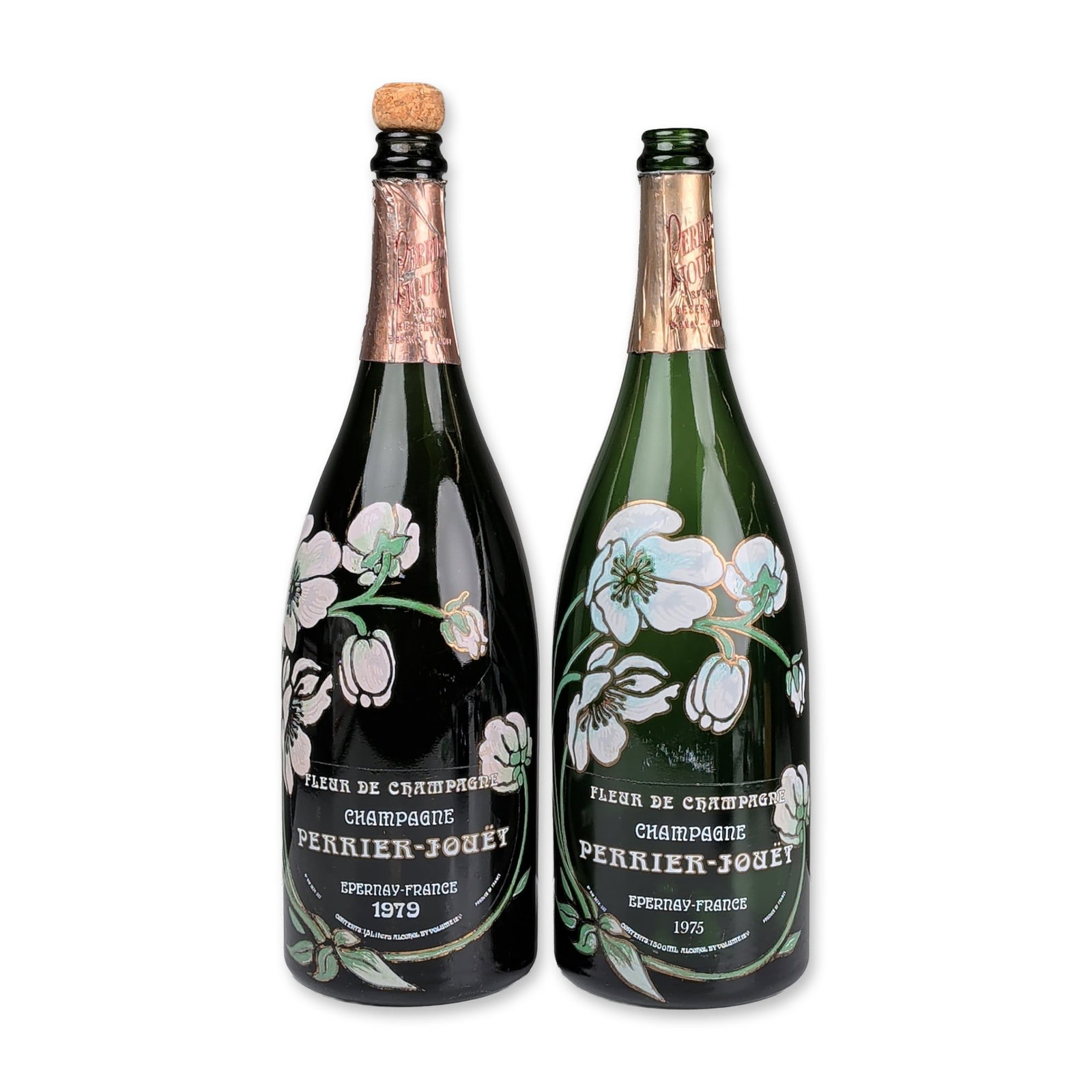 2pc Perrier-Jouet Fleur de Champagne Vintage Magnum Bottles: French enameled green glass champagne bottles by Perrier-Jouet. Two pieces total, comprising one 1975 vintage and one 1979 vintage. Each bottle features the signature Art Nouveau anemone motif in