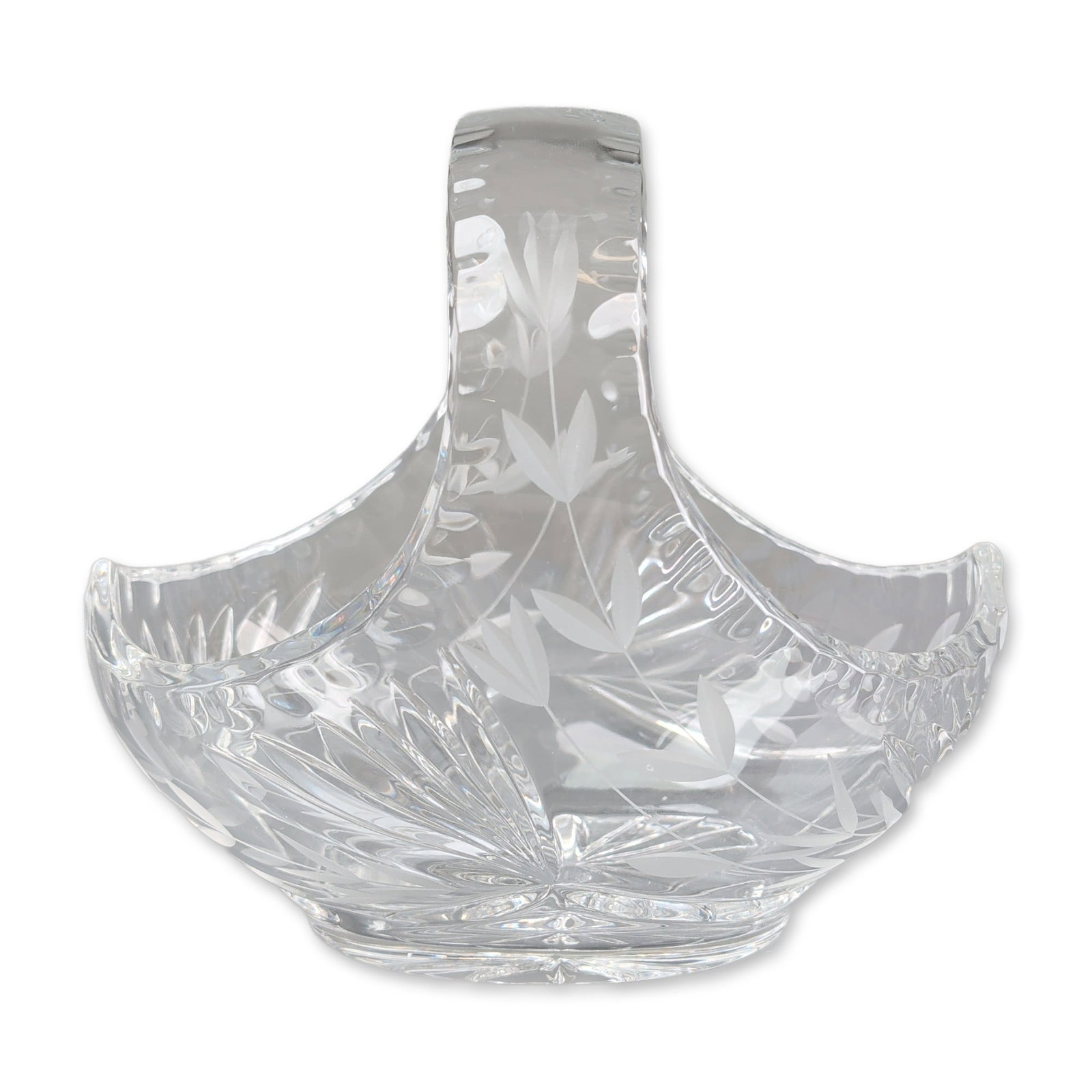 Floral and Fan Cut Crystal Basket: Cut crystal basket in clear lead glass featuring an integral handle over a deep flared bowl. The exterior is decorated with deep-cut radial fan patterns at the base of the handle and lower body,