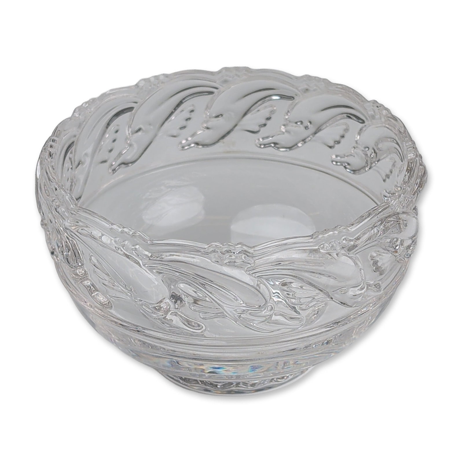 Tiffany & Co. Crystal Dolphin Bowl: Tiffany & Co. crystal pedestal bowl with molded dolphin and wave decoration. The bowl features a flared, scalloped rim with a notched edge and a textured exterior depicting stylized dolphins leaping