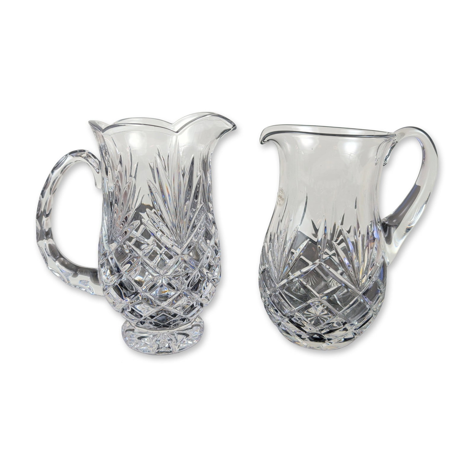 2pc Samobor Kristal Cut Lead Crystal Pitchers: Samobor Kristal hand-cut lead crystal pitchers from Croatia. Pair of pitchers in 24 percent lead crystal, featuring deep geometric hand-cut patterns including cross-hatched diamond fields, vertical fa
