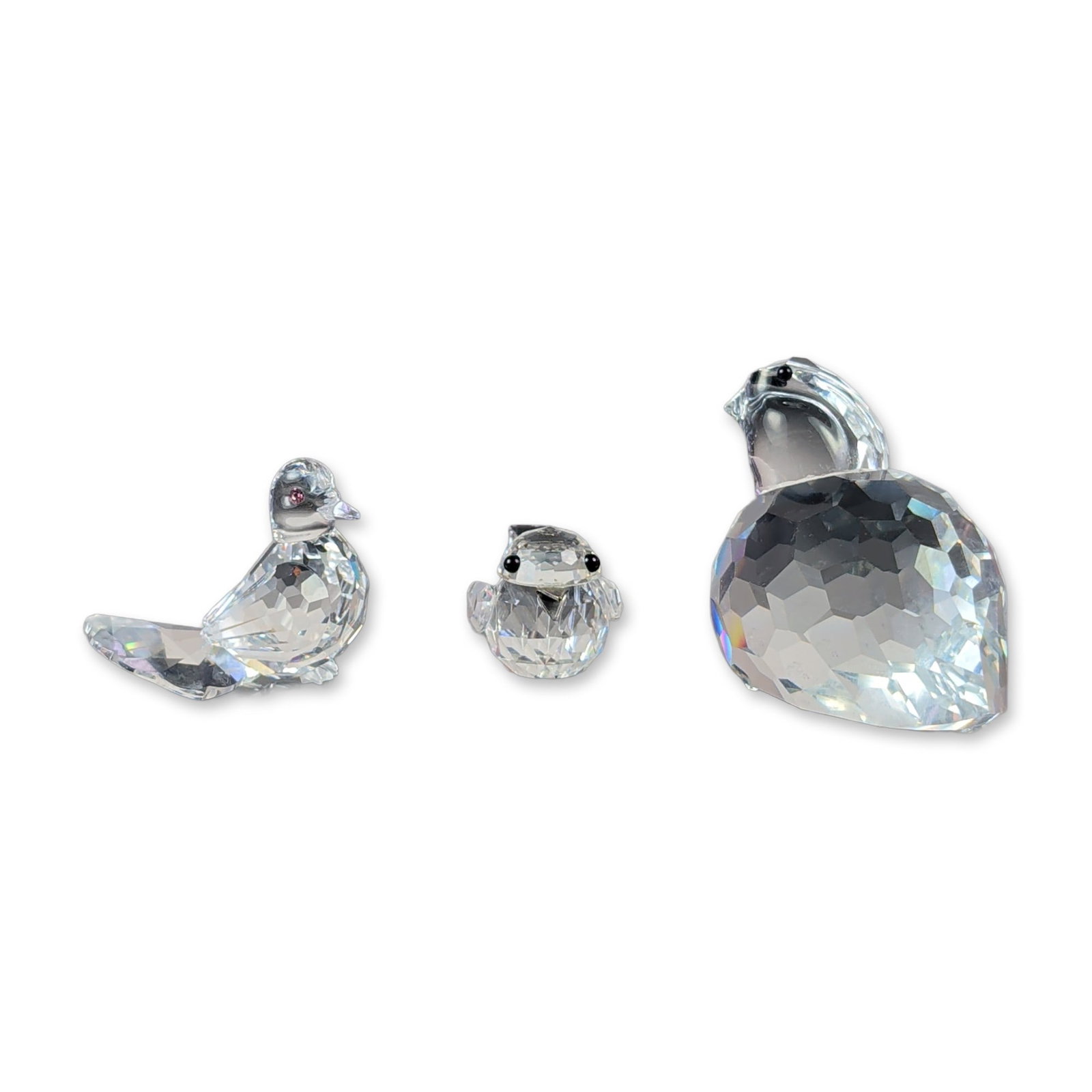 3pc Swarovski Silver Crystal Bird Figurine Set: Dove, Chick, and Partridge: This crystal set features three avian wildlife specimens curated from the Swarovski Silver Crystal collection, comprising a miniature dove, a compact chick, and a larger partridge. Each piece is craft