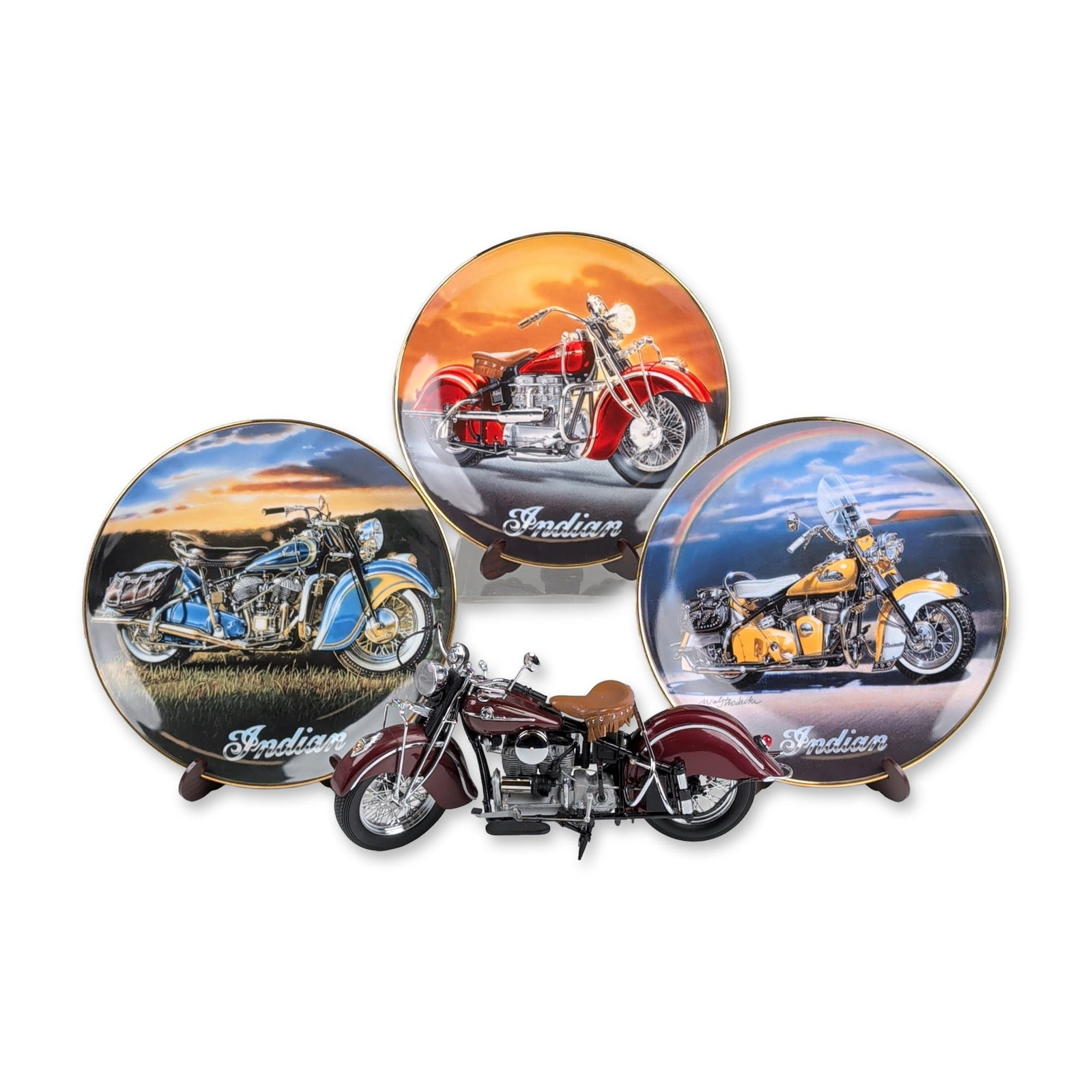 4pc Franklin Mint 1942 Indian Motorcycle Model plus Royal Doulton Plate Set: The group includes a die-cast model of a 1942 Indian 442 finished in maroon paint with a tan fringed saddle and chrome-tone accents. The underside of the engine block is incised with the characters 19
