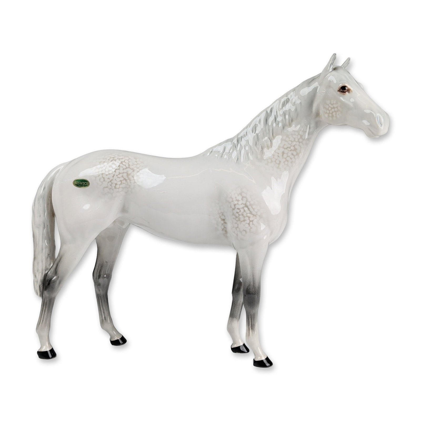 Beswick England Dapple Grey Ceramic Horse: Beswick glazed ceramic horse figurine in a dapple grey colorway. The standing figure features grey mottled dappling on the neck, shoulders, and hindquarters, with solid charcoal grey coloration on the