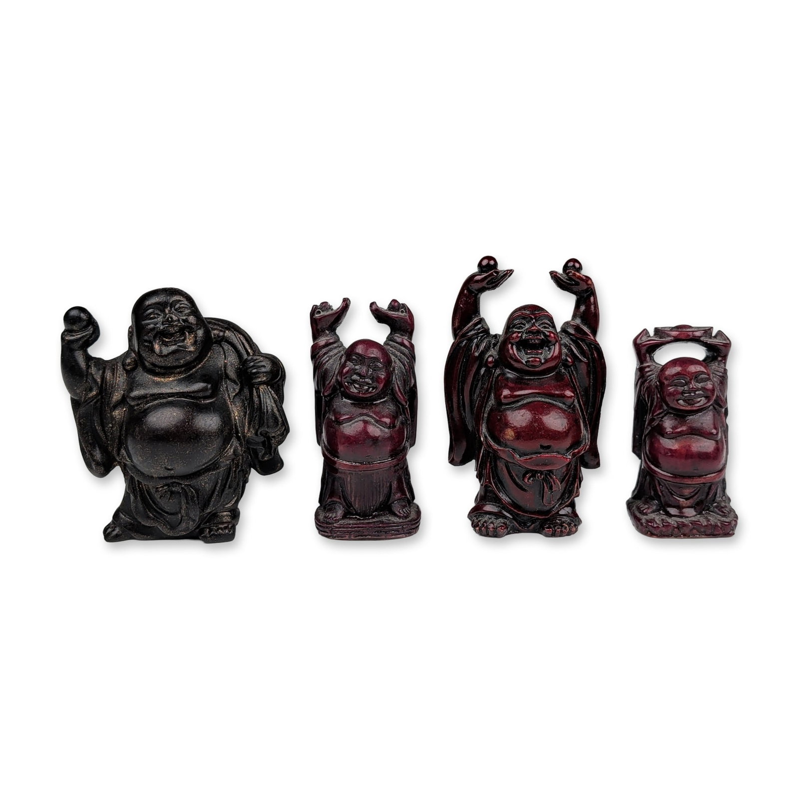 Group of Four Miniature Resin Laughing Buddha Figurines: Group of miniature laughing Buddha (Hotei) figurines in cast resin, featuring varied poses and finishes. The lot includes one figure with a dark wood-style finish and bronze-toned highlights, depictin