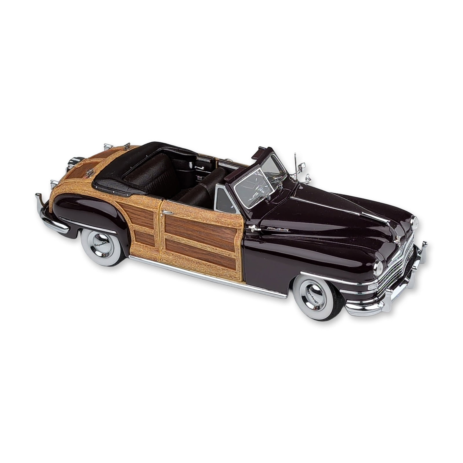 Danbury Mint Classic Cars 1948 Chrysler Town & Country Convertible Replica: The Danbury Mint 1948 Chrysler Town & Country Convertible 1:24 scale die-cast model in Regal Maroon with simulated wood-grain panels. The vehicle features an opening hood with a detailed engine bay, o