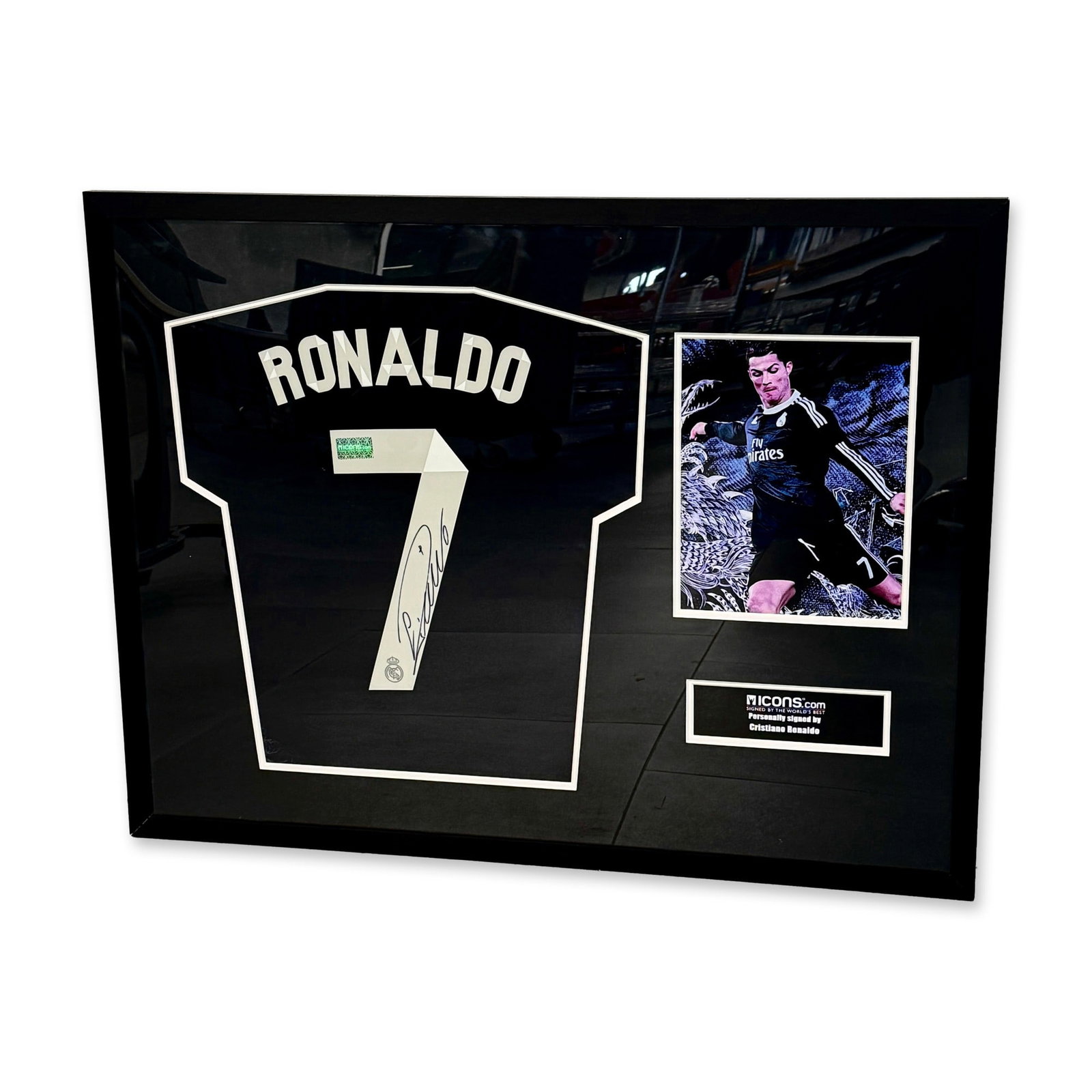 Cristiano Ronaldo Signed Real Madrid Jersey w/ COA: Framed Cristiano Ronaldo signed Real Madrid jersey number display featuring a jersey with number 7 signed by Cristiano Ronaldo in blue ink with stylized cursive lettering. The display includes a