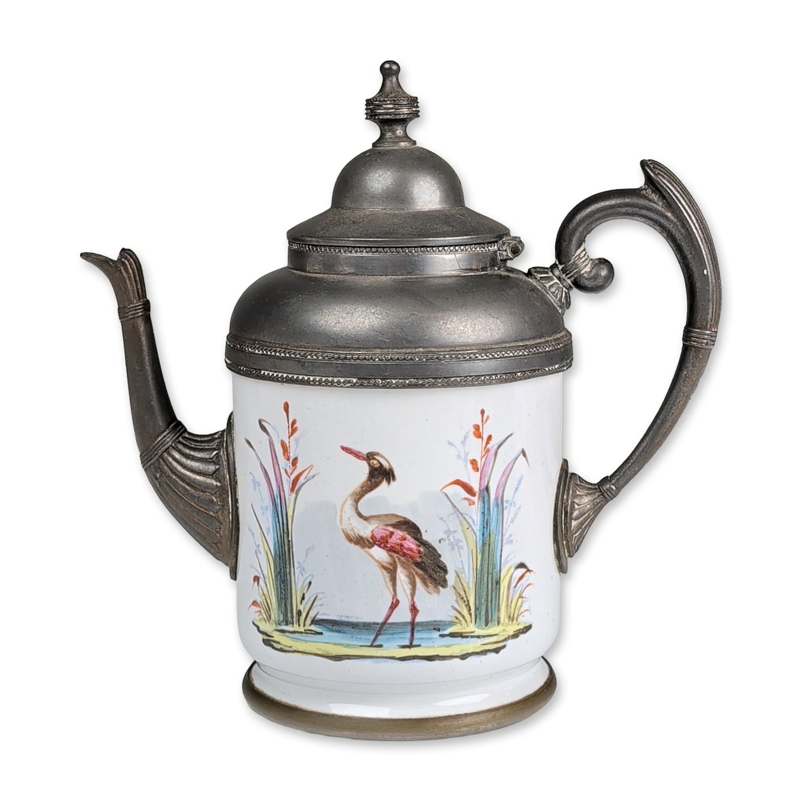 Hand Painted Enamel and Metal Miniature Pot: The piece features a cylindrical glazed ceramic body decorated with a hand-painted enamel scene depicting a heron or crane standing in a marsh landscape with reeds and water plants in shades of blue, 
