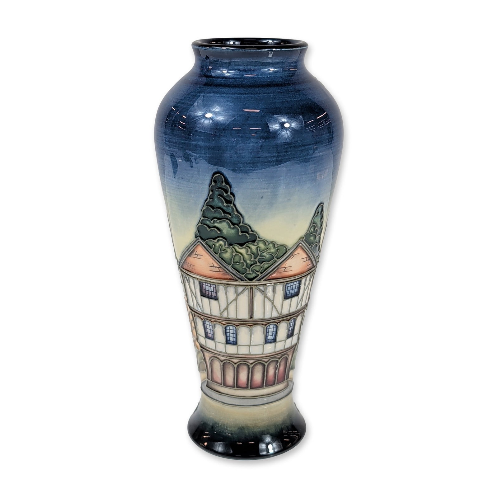 Philip Gibson for Moorcroft Thaxted Vase: Moorcroft earthenware vase in the Thaxted pattern designed by Philip Gibson. The vessel features tubelined and hand-painted decoration depicting the historic town of Thaxted in Essex, England, with th