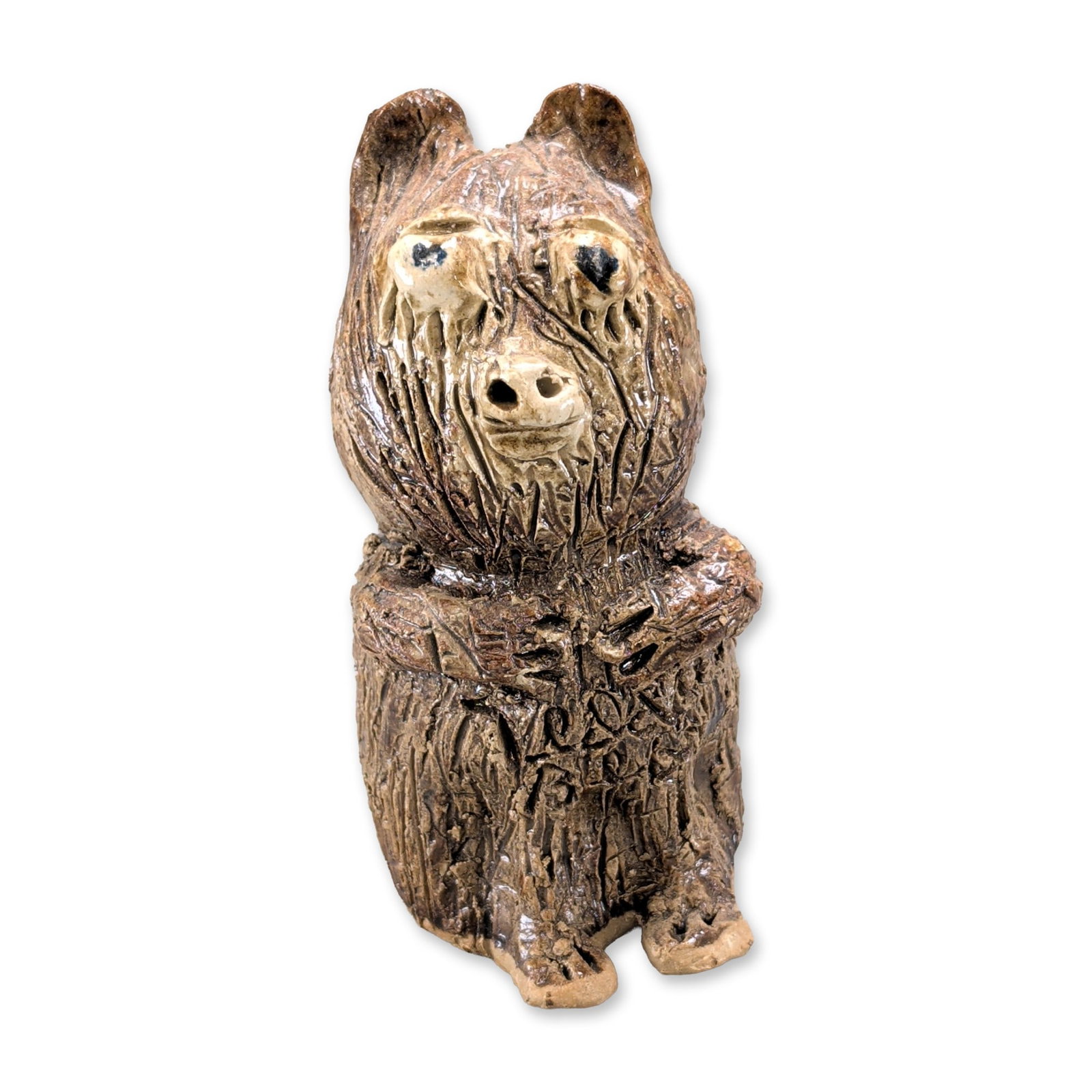 Marie Rogers Pottery Teddy Bear Figurine: Mid-20th century style bear figurine in glazed ceramic, featuring an upright pose with folded arms and deep vertical incisions to simulate fur texture. The piece is finished in a high-gloss two-tone