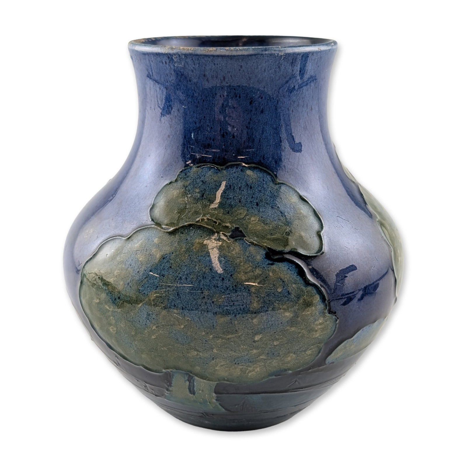 Moorcroft Moonlit Blue Pattern Pottery Vase: Early 20th-century pottery vase by Moorcroft, featuring the Moonlit Blue pattern with tubelined stylized trees in shades of green and ochre against a deep cobalt ground. The underside of the base feat