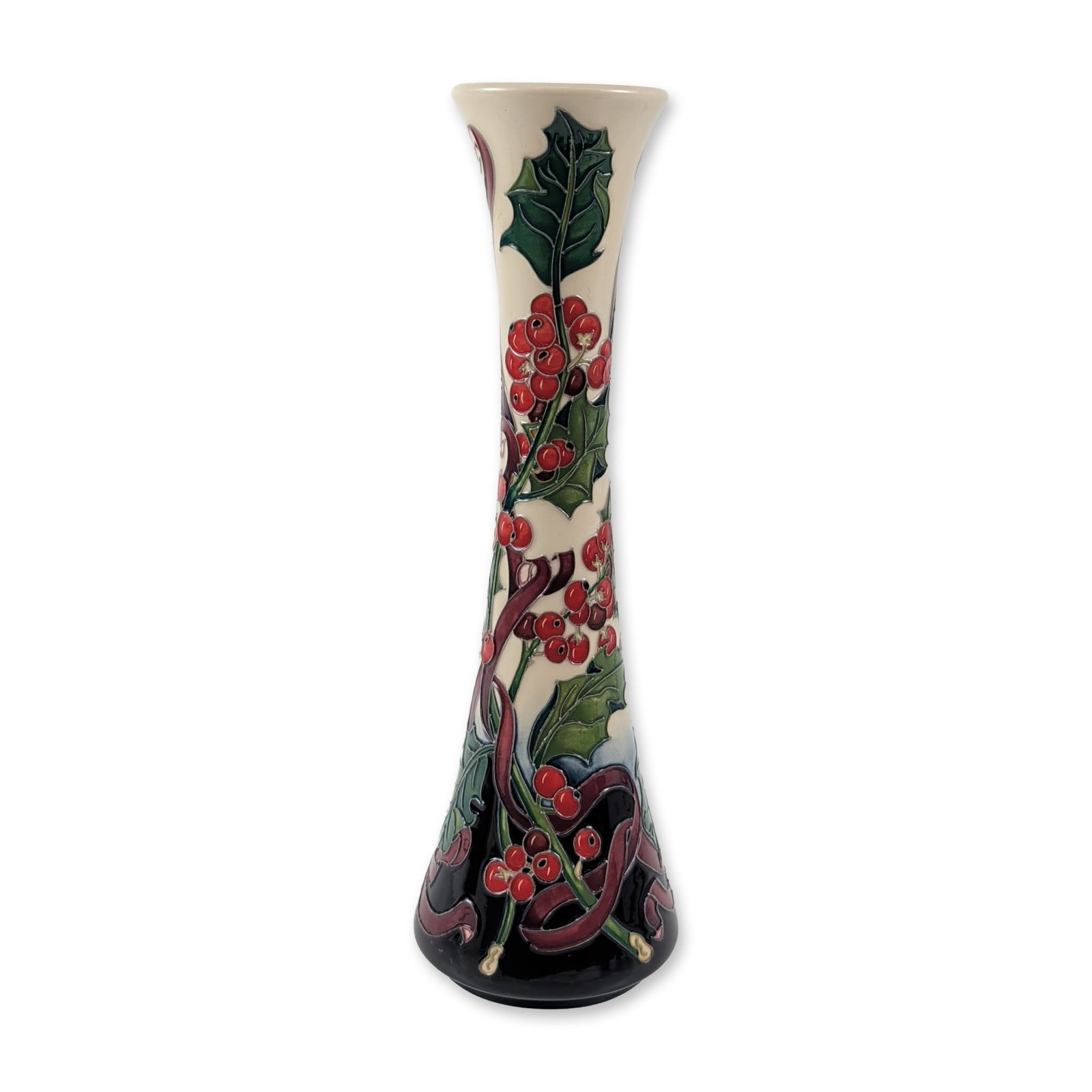 Moorcroft Paul Hilditch Holly and Ribbons Vase: Moorcroft pottery tall trumpet or flute-form earthenware vase in the Holly and Ribbons pattern designed by Paul Hilditch. The tube-lined decoration features stylized green holly leaves and clusters of