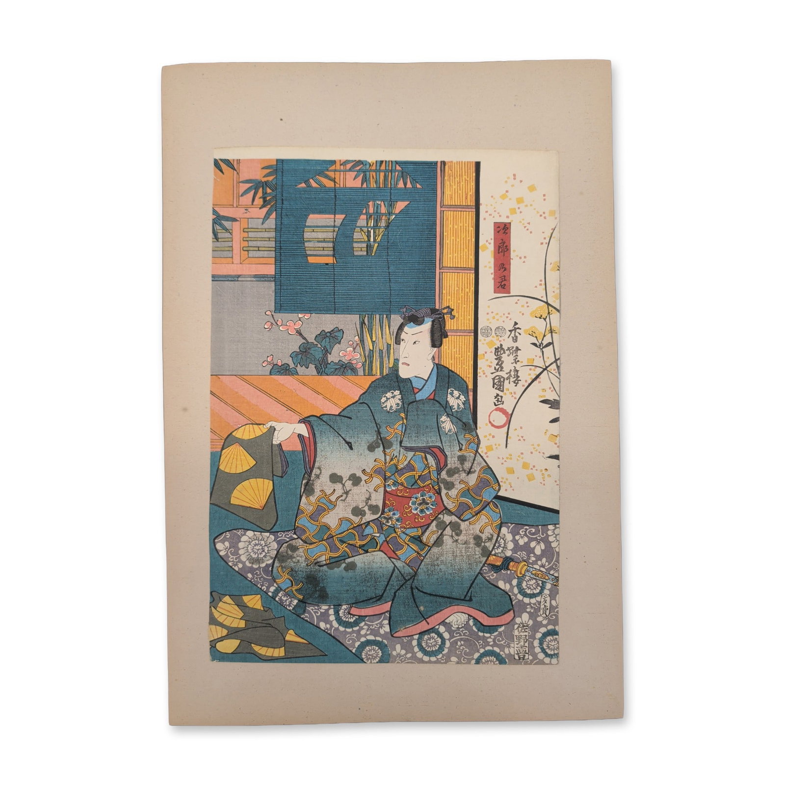 Utagawa Kunisada (Toyokuni III) (Japanese, 1786-1865) Elegant Prince Genji Woodblock Print: A nobleman sits elegantly in a lavishly patterned floral kimono, looking back toward the right as the standalone center panel of an interior narrative sequence. This 19th-century ukiyo-e design showca