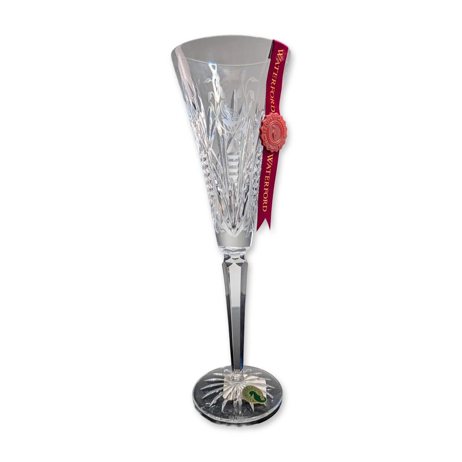 Waterford Crystal 12 Days of Christmas Fluted Champagne, A Partridge In A Pear Tree: Waterford Irish lead crystal champagne flute in the first edition Partridge in a Pear Tree design from The 12 Days of Christmas collection. The trumpet-style bowl features an intaglio-etched scene of