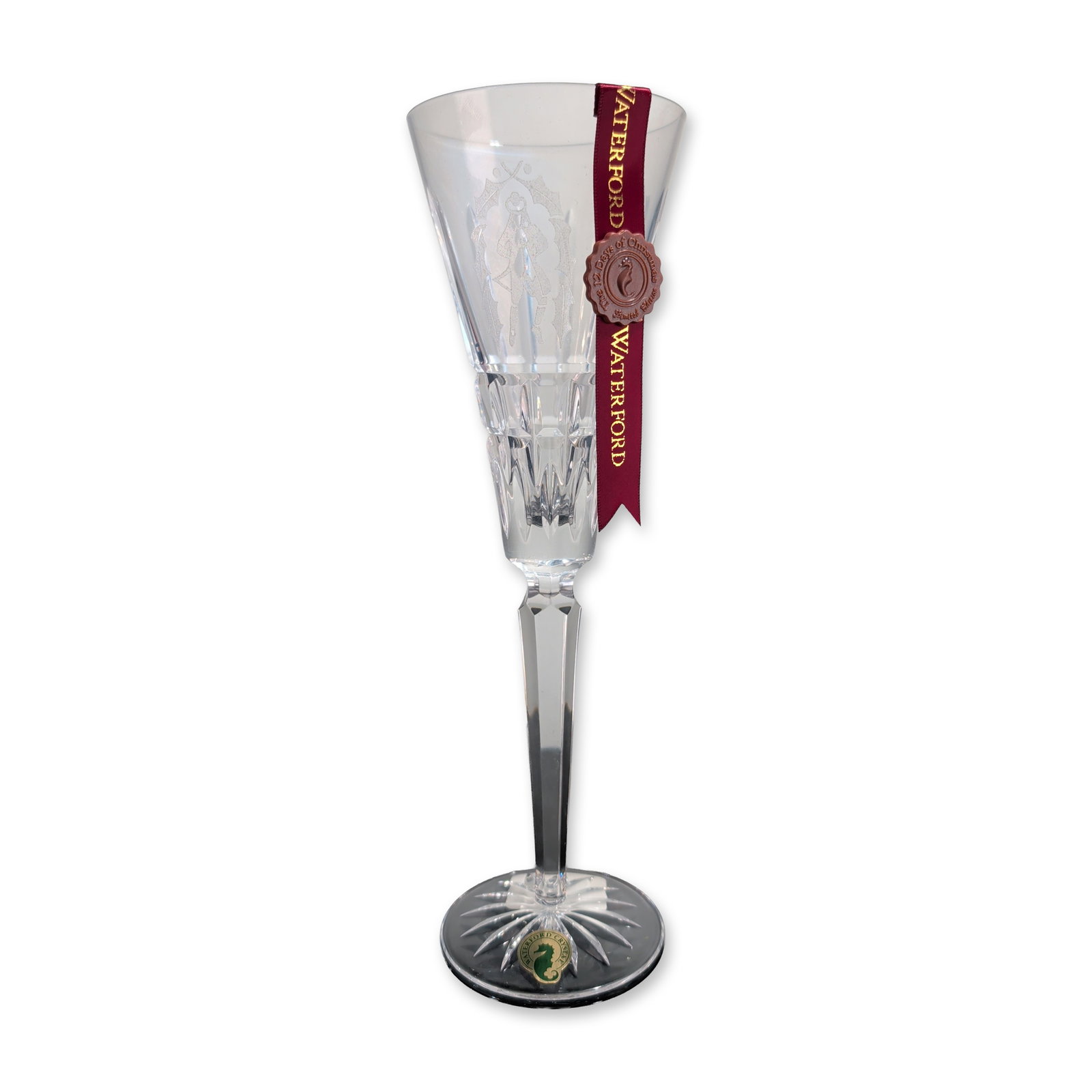 Waterford Crystal 12 Days of Christmas Fluted Champagne, Ten Lords A-Leaping: Waterford lead crystal champagne flute from the 12 Days of Christmas Collection. This 10th edition piece features an etched depiction of a Lord A-Leaping surrounded by holly sprigs on the upper bowl, 