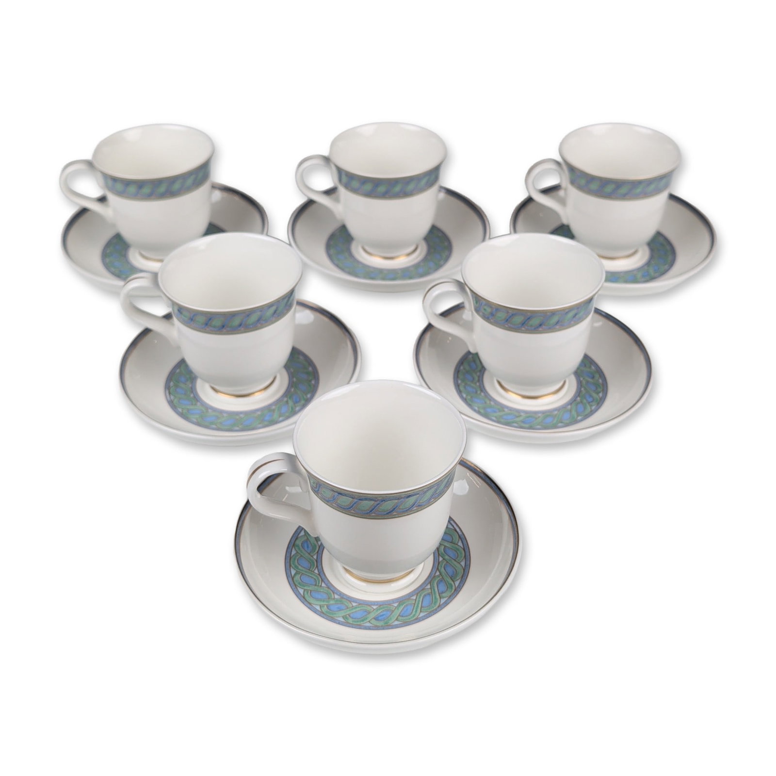 12pc Christofle Torsada Porcelain Demitasse Cups and Saucers: A set of six demitasse cups and six saucers in fine white porcelain that features the Torsada pattern, displaying a continuous braided cable motif in teal-blue and green tones, finished with gilt rims