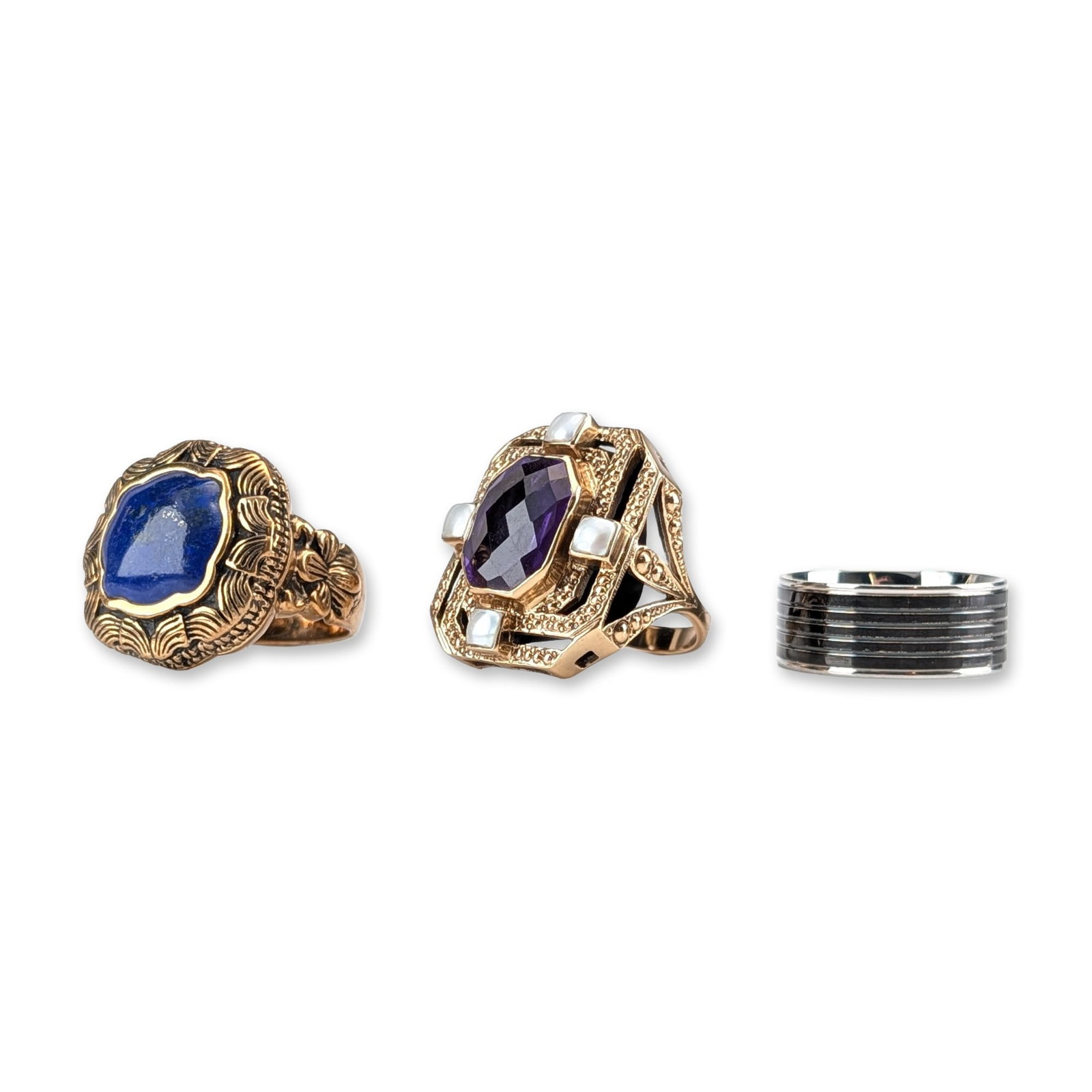3pc Barse, Nicky Butler, and Steeltime Rings: Trio of assorted rings including one Barse statement cocktail ring in gold-tone base metal featuring a large bezel-set blue lapis lazuli cabochon with ornate floral and scrollwork shoulders, stamped B