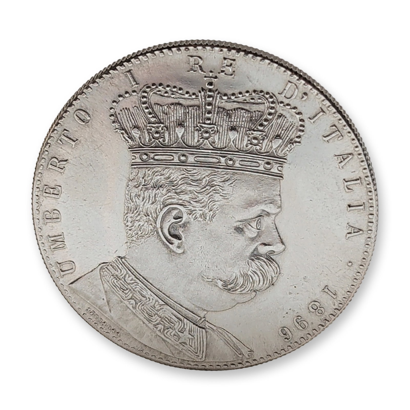 Replica 1896 Italian Eritrea 5 Lire Silver Tallero Coin: Kingdom of Italy colonial issue for Eritrea, dated 1896. 5 Lire (Tallero) silver coin featuring King Umberto I to the obverse and the crowned Savoy eagle to the reverse, with Arabic and Ethiopic denom