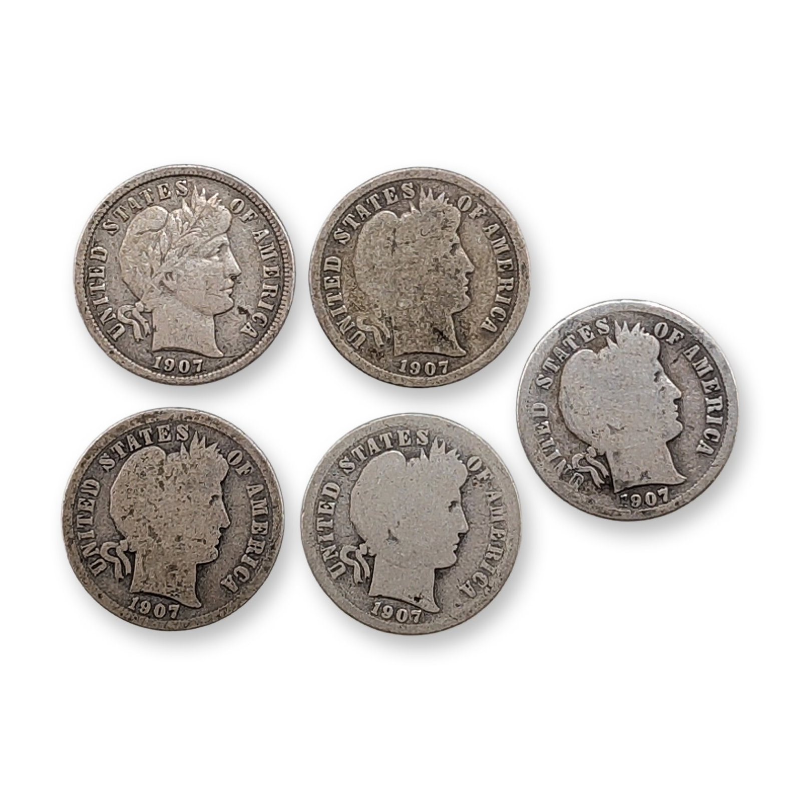 5pc 1907, 1907-D, 1907-O, 1907-S US Barber Silver Dime Coins: US 1907 silver Barber dimes, featuring examples from Philadelphia, Denver, San Francisco, and New Orleans mints. Struck in 90% silver, each coin displays the obverse design by Charles E. Barber and an