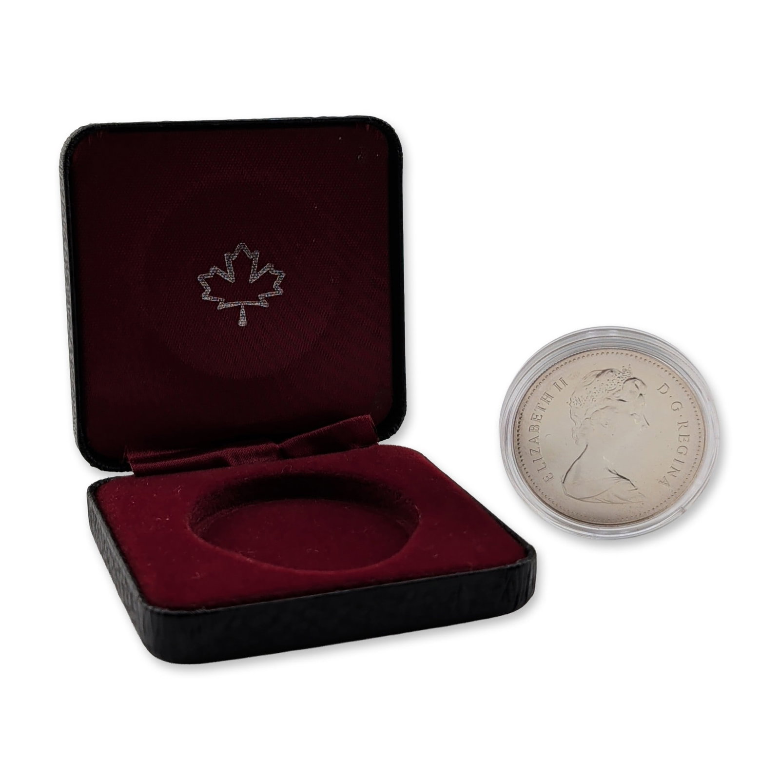 1979 Canada Queen Elizabeth II Griffon Silver Dollar Coin: CA, 1979. Commemorative dollar in .728 fine silver, issued for the 300th anniversary of the sailing vessel Le Griffon. Obverse features a right-facing portrait of Queen Elizabeth II with legends readi