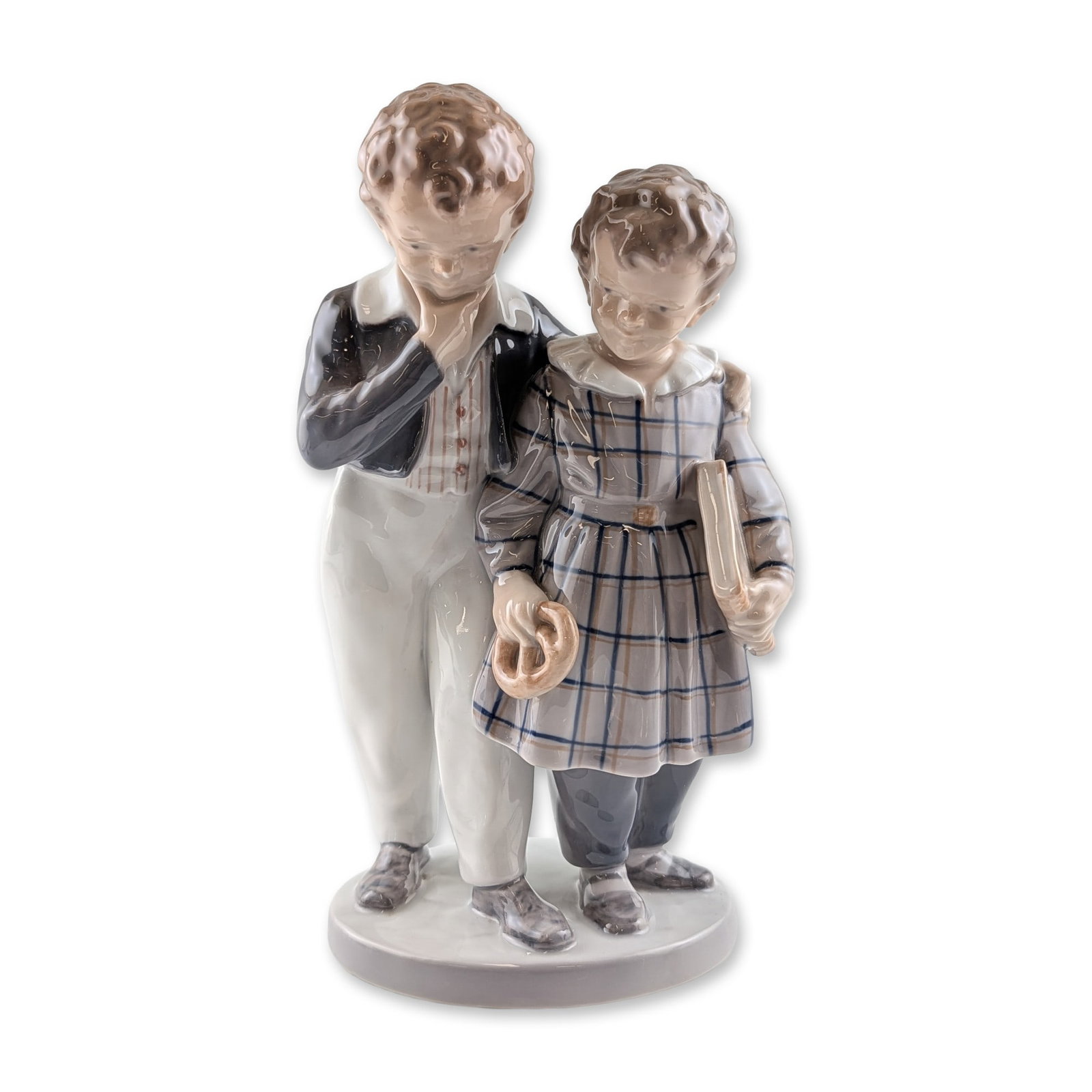 Royal Copenhagen Flight to America Porcelain Figurine: Royal Copenhagen glazed porcelain figurine titled Flight to America, model number 1761, designed by Christian Thomsen. The sculpture depicts two young children standing on a circular base; a boy in a 
