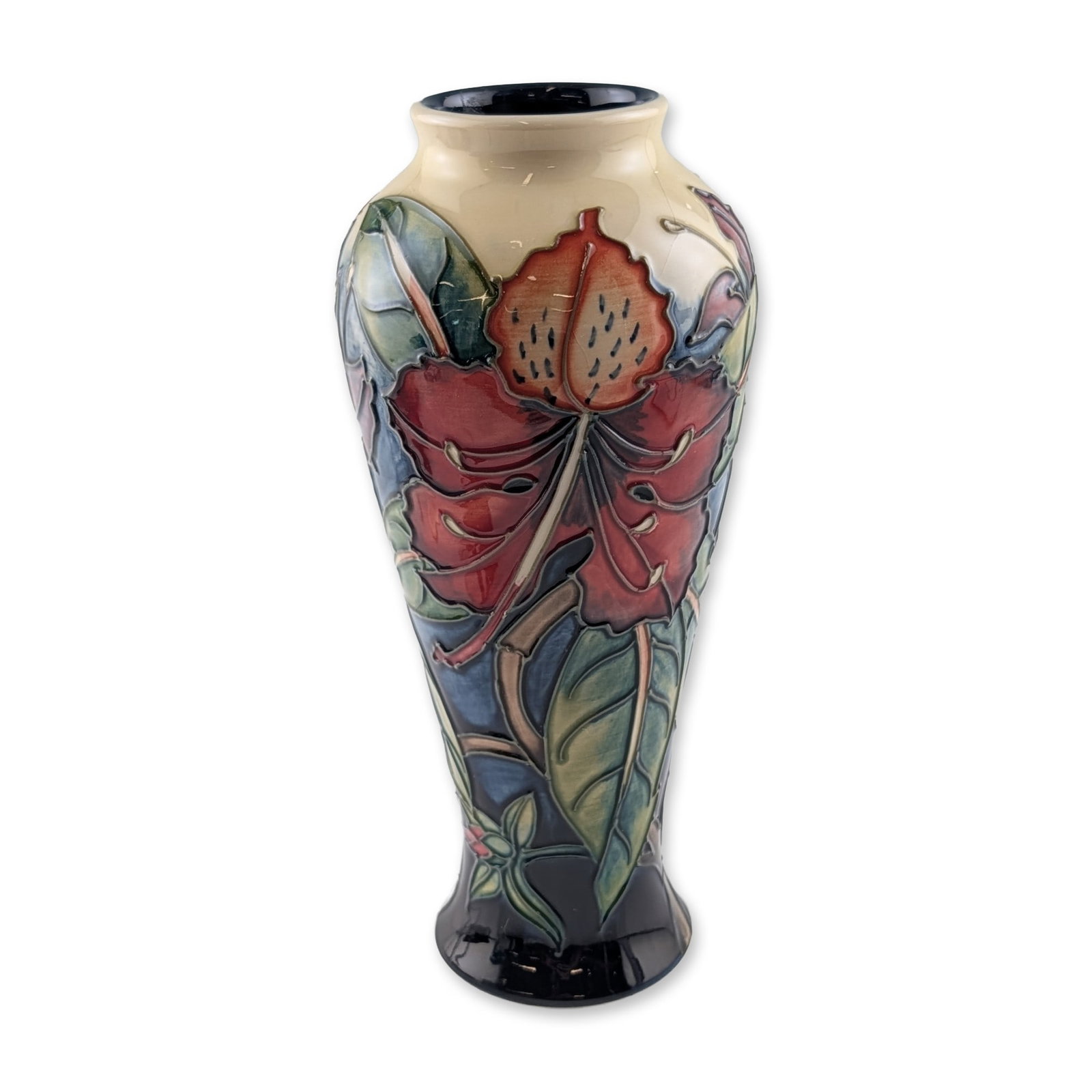 Moorcroft Philip Gibson Simeon Pattern Vase: A Moorcroft art pottery vase in the Simeon pattern, designed by Philip Gibson. This earthenware vessel features tubelined floral blossoms in shades of red and coral with green foliage against a multi-