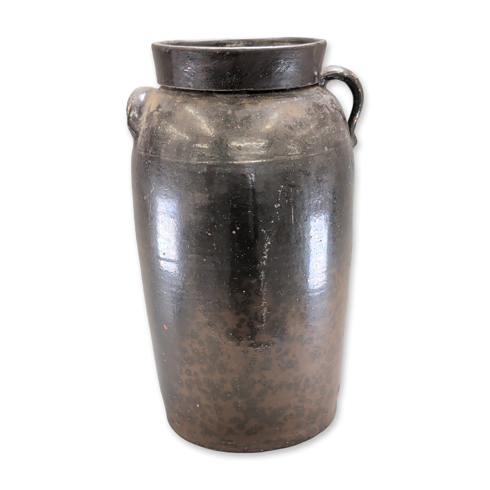 B.S Salter Stoneware Large Crock Jug: The cylindrical vessel features a slightly flared rim and two opposing lug handles at the shoulder, tapering slightly toward an unglazed, flat base. The exterior is covered in a dark manganese-saturat
