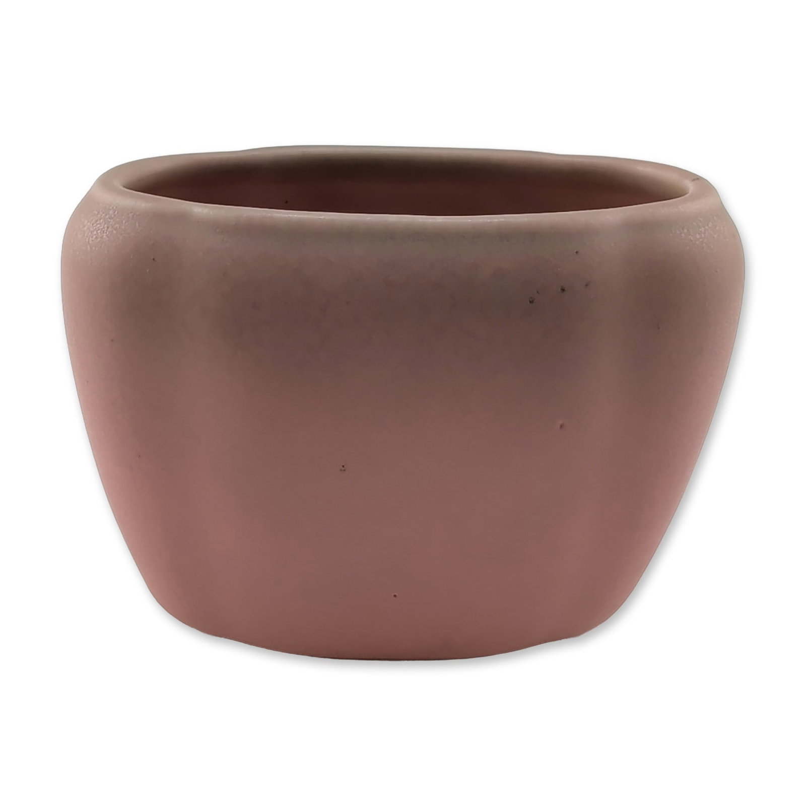 1928 Rookwood Pottery Matte Pink Cabinet Planter: Rookwood Pottery cabinet planter, dated 1928. American art pottery vessel of rounded rectangular form with tapering sides, finished in a uniform matte pink glaze. The base bears the impressed Rookwood