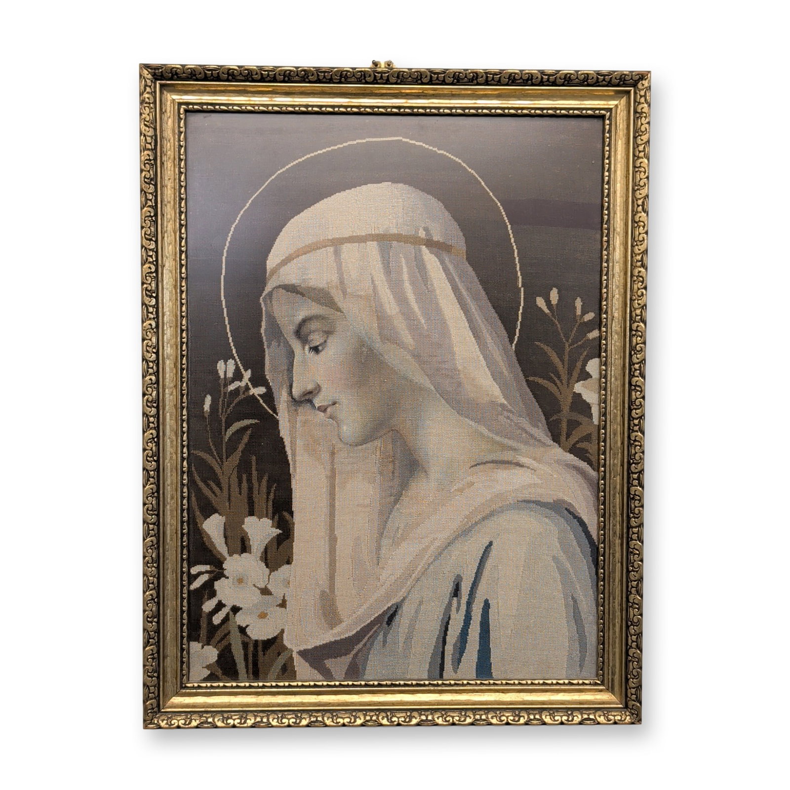 Needlepoint, 20th Century, 'Virgin Mary in Profile': Continental School, 20th century. Needlepoint tapestry in wool and silk threads on canvas, featuring a profile of the Virgin Mary with a halo and stylized lilies in a muted tonal palette. Presented in