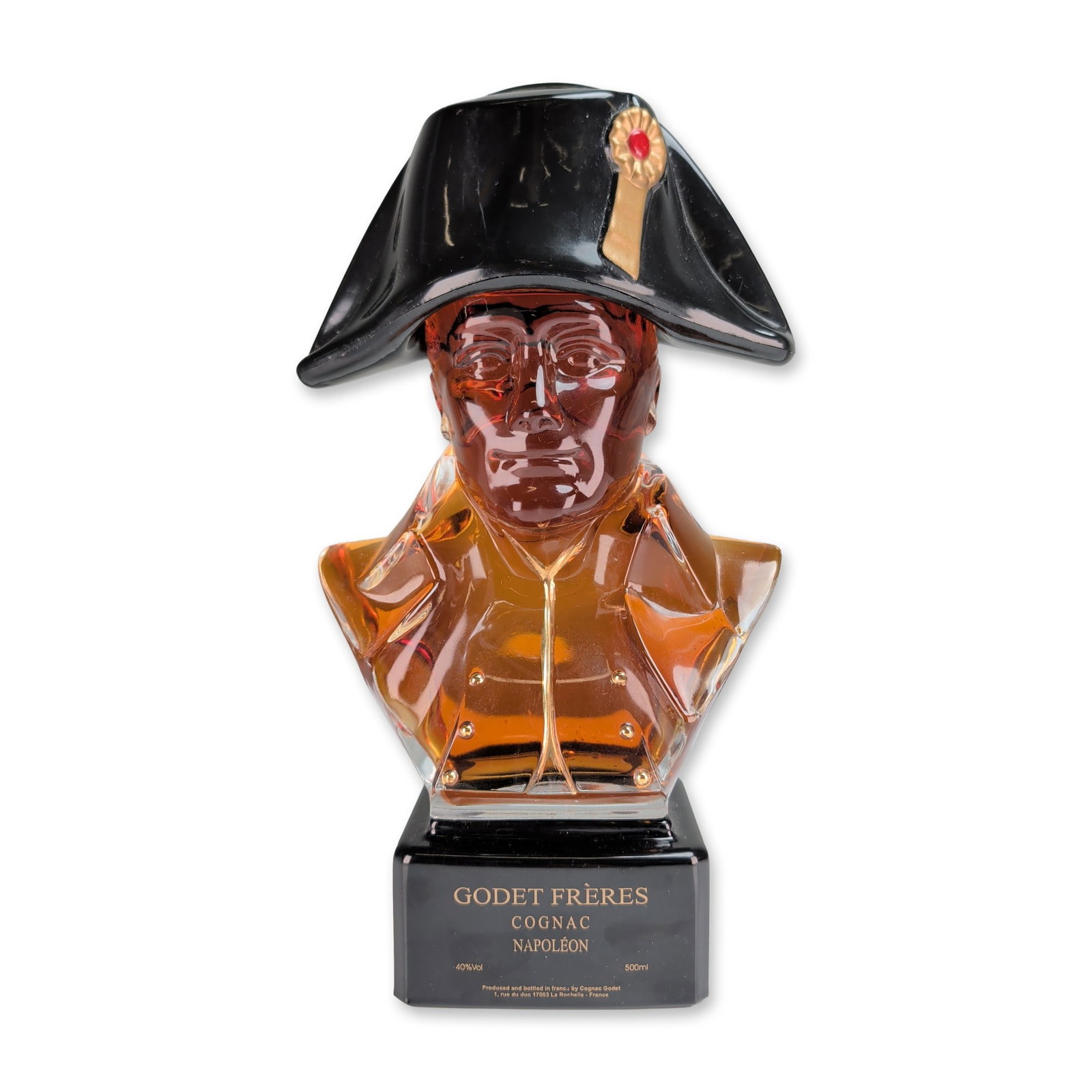 Godet Freres Napoleon Cognac Bust Decanter w/ Bicorne Hat Stopper: Godet Freres, La Rochelle, France, Napoleon Cognac decanter in the form of a glass bust depicting Napoleon Bonaparte. The 500ml clear glass vessel is topped with a black bicorne hat serving as the sto