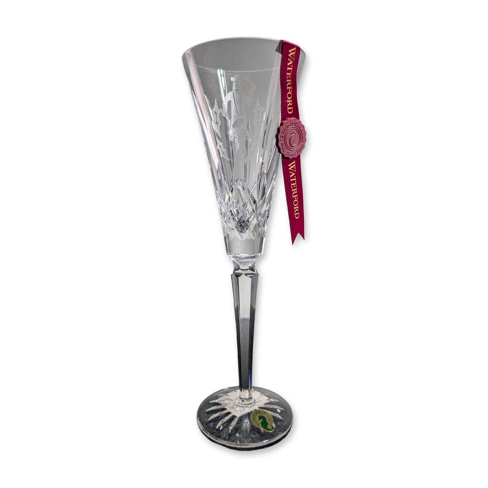 Waterford Crystal 12 Days of Christmas Fluted Champagne, Twelve Drummers Drumming: Waterford Crystal lead crystal champagne flute, 12th edition of the 12 Days of Christmas series with an accompanying charm. The vessel features a conical bowl with deep diamond and vertical wedge cuts
