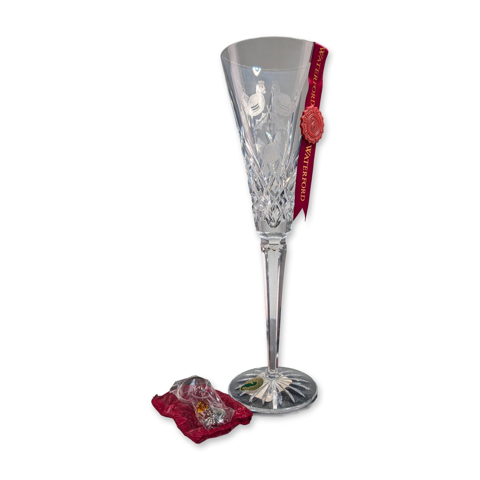 Waterford Crystal 12 Days of Christmas Fluted Champagne, Three French Hens: Waterford Twelve Days of Christmas collection lead crystal champagne flute, 3rd Edition, with a silver-toned charm. The bowl features an etched motif of three French hens and holly above diamond and