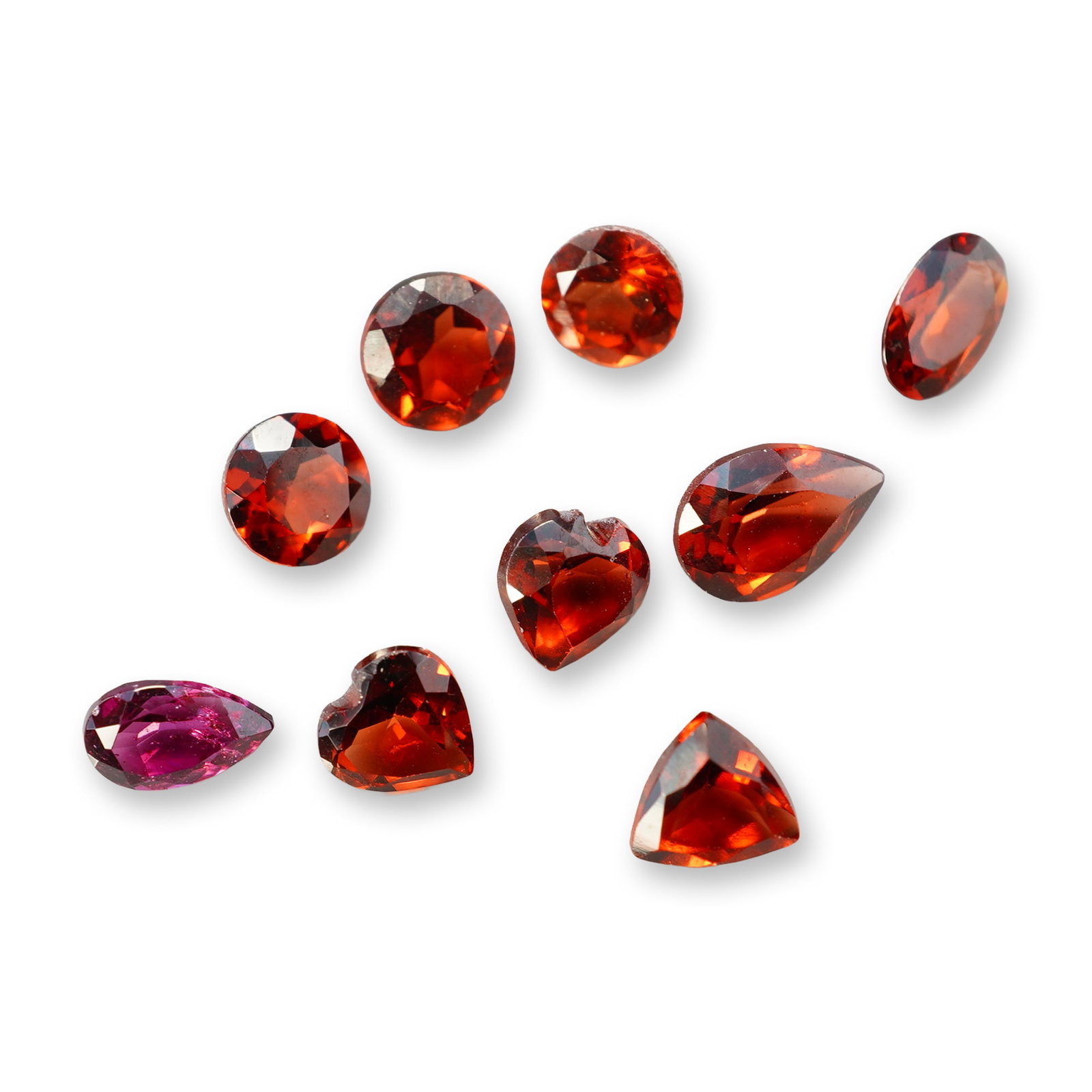 9pc Red Garnet Gemstones in Vatious Shapes and Sizes: Grouping of 9 garnet gemstones. The spiritual meaning of a garnet centers on vitality, protection, and devotion. Known as a stone of passion and commitment, it is highly valued for grounding scattered