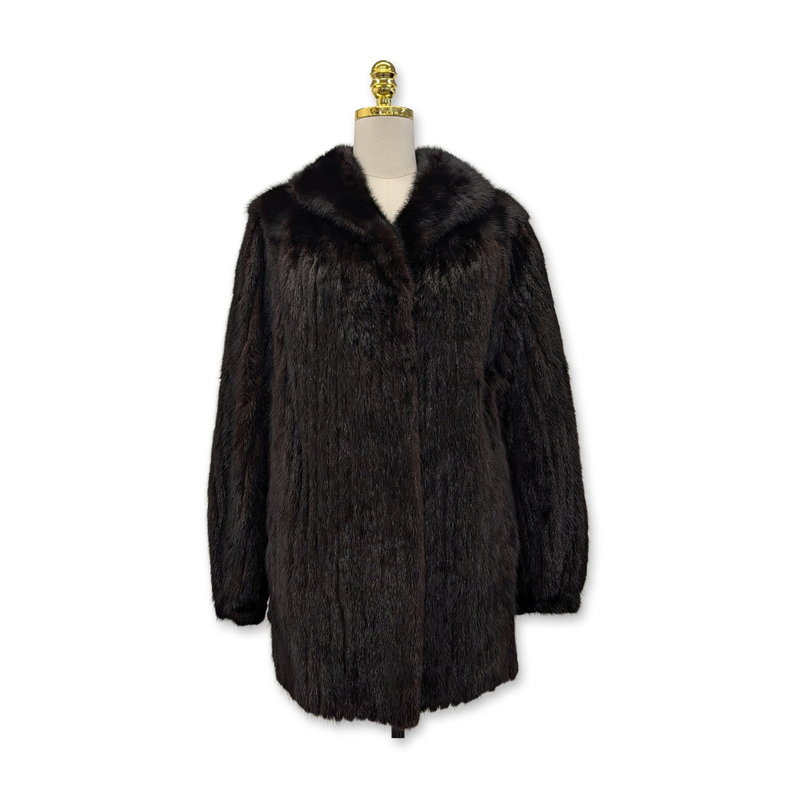 Saga Mink Vintage Mahogany Brown Fur Stroller Coat: A vintage stroller-length coat in dark mahogany brown mink fur, circa 1970s-1980s. The garment features full-skin pelts in a vertical orientation, a classic shawl collar, long sleeves, and two side-en