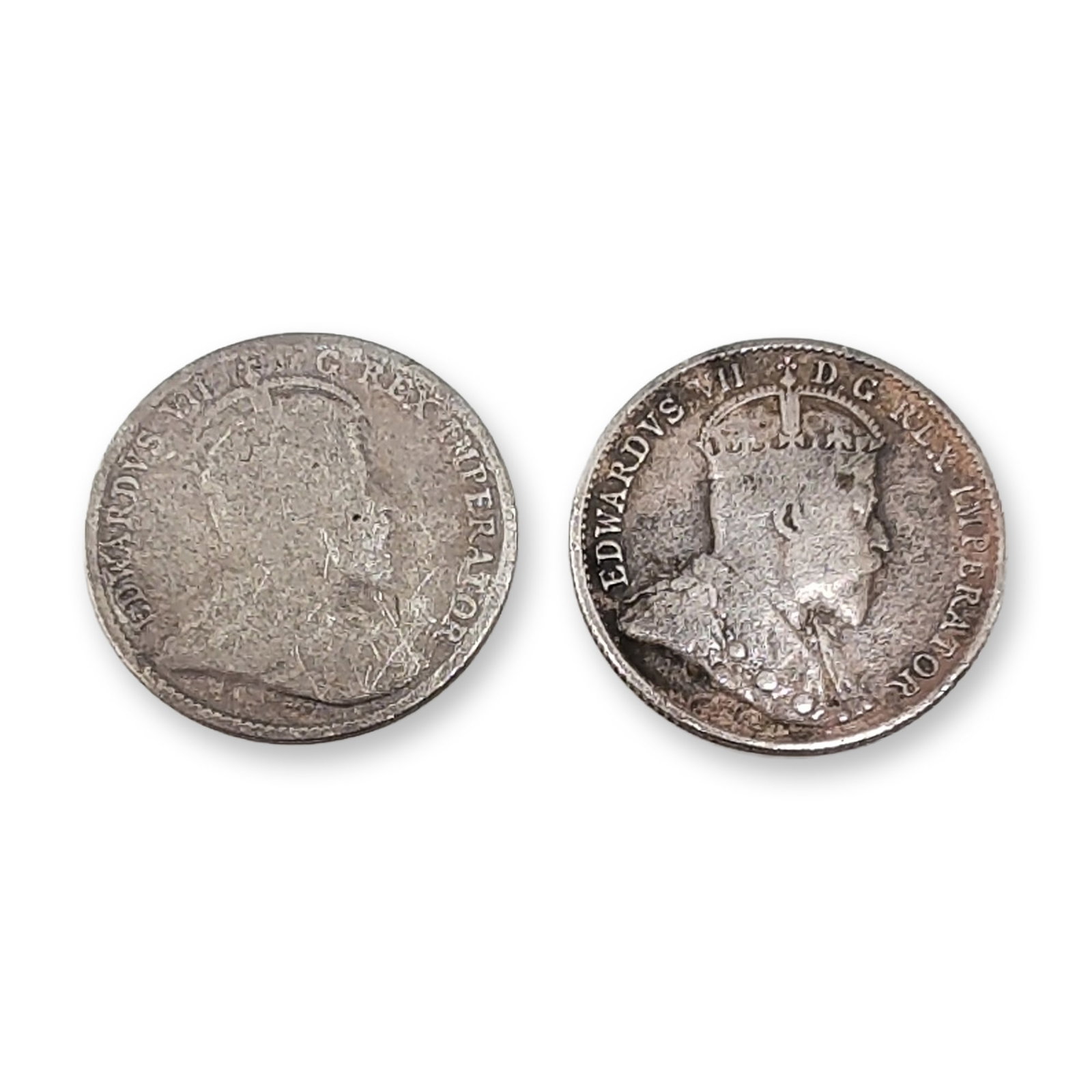 2pc 1904, 1907 Canada Silver 5 Cents Edward VII Coins: Canada, Edward VII. Pair of silver five-cent coins dated 1904 and 1907. Each coin is struck in .925 sterling silver with a reeded edge. The obverse features a right-facing profile portrait of King Edw