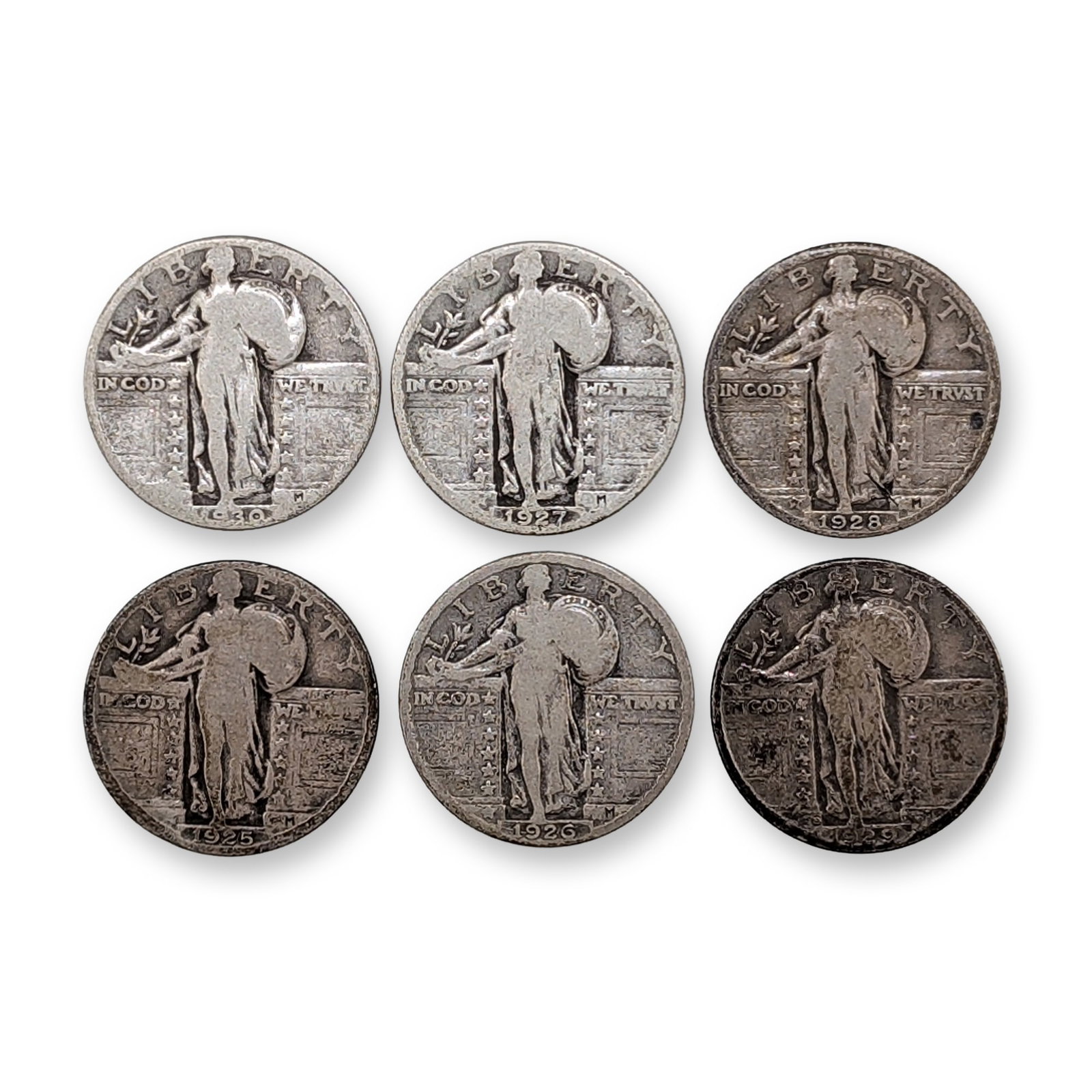 6pc 1925 - 1930 US Standing Liberty Silver Quarter Coins: US Standing Liberty quarters, 1925-1930. Group of six coins in 90 percent silver featuring the Hermon A. MacNeil design. Obverse depicts Liberty between two pedestals with inscriptions for LIBERTY and
