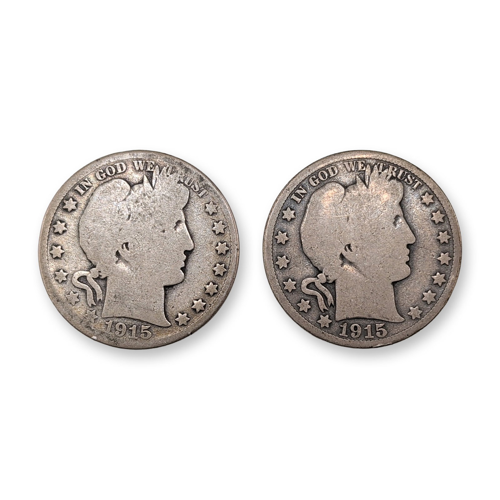 2pc US 1915-S Barber Silver Half Dollar Coins: US Mint. A pair of Barber half dollars in 90% silver, both dated 1915. The obverse features a right-facing profile of Liberty wearing a laurel wreath and Phrygian cap, with the legend IN GOD WE TRUST 