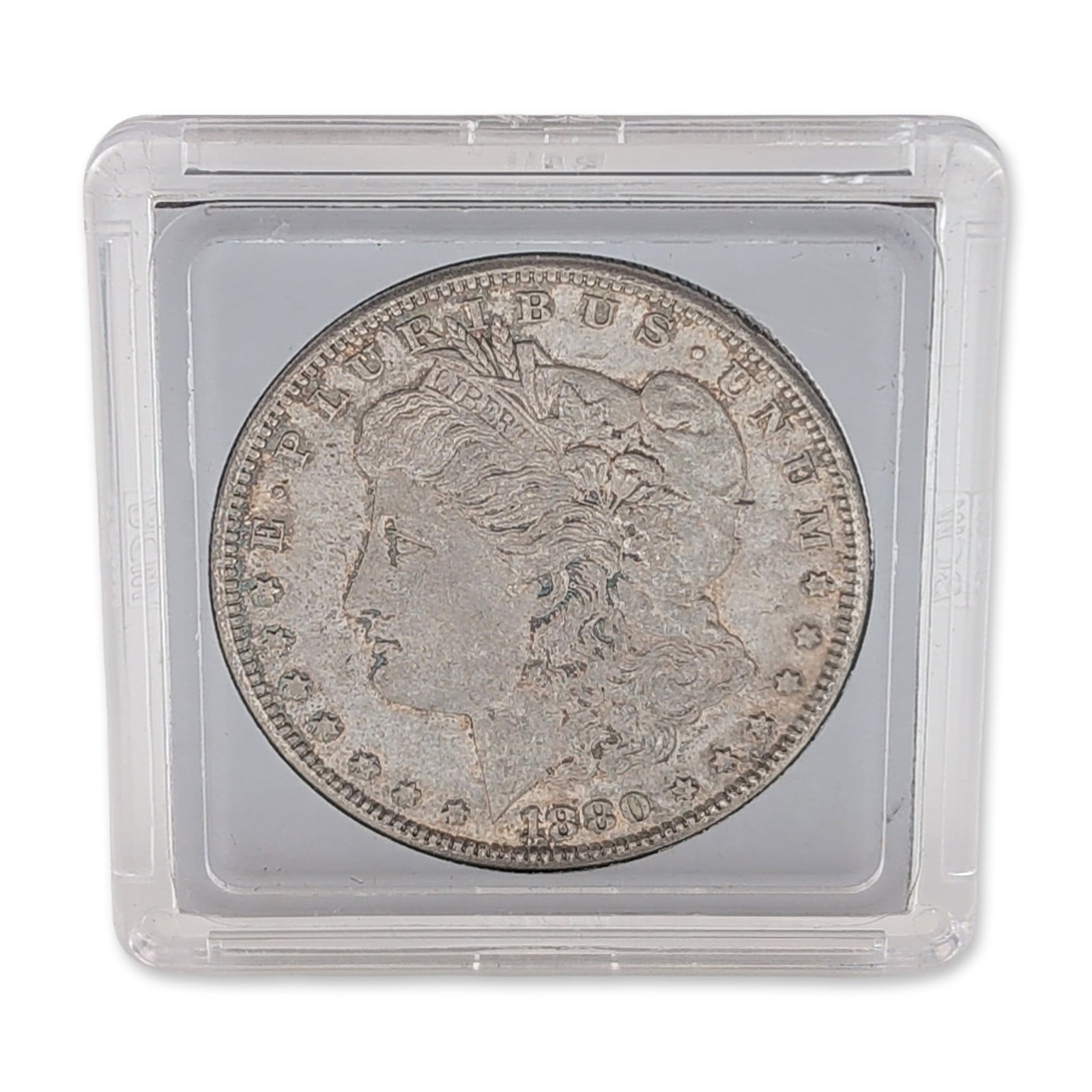 1880-S US Morgan Silver Dollar Coin: 1880-S Morgan silver dollar, minted at the San Francisco facility, in 90% silver, featuring the Liberty head obverse and heraldic eagle reverse. Legends include the character-by-character inscriptions