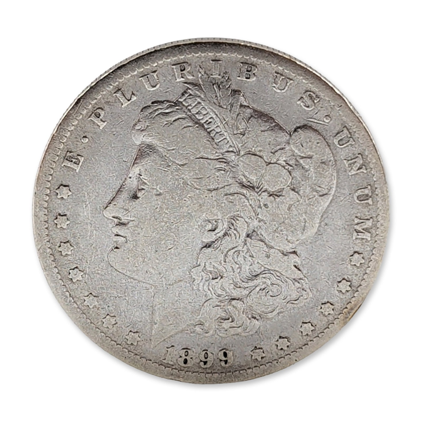 1899-O US Morgan Silver Dollar Coin: US Morgan silver dollar is composed in 90 percent silver and 10 percent copper. Features the Morgan design obverse and Heraldic Eagle design reverse. Bears a legible O mint mark for the New Orleans Mi
