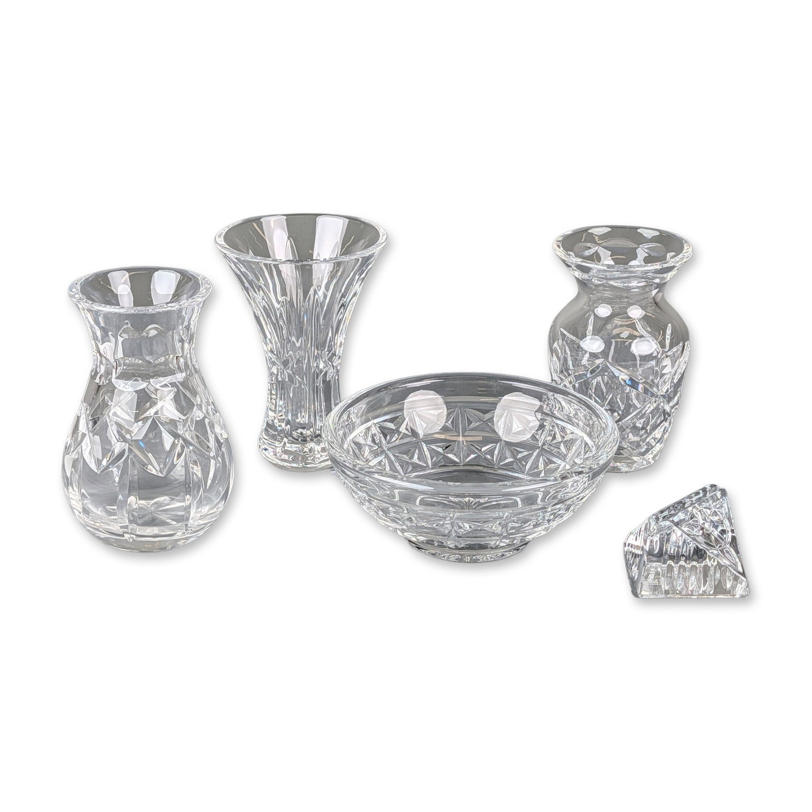 5pc Waterford and Waterford Society Cut Crystal Bud Vases and Bowl: Collection of cut lead crystal decorative objects including vases of various forms, a circular bowl, and a triangular prism, featuring diamond and starburst patterns. Items bear marks for Waterford an