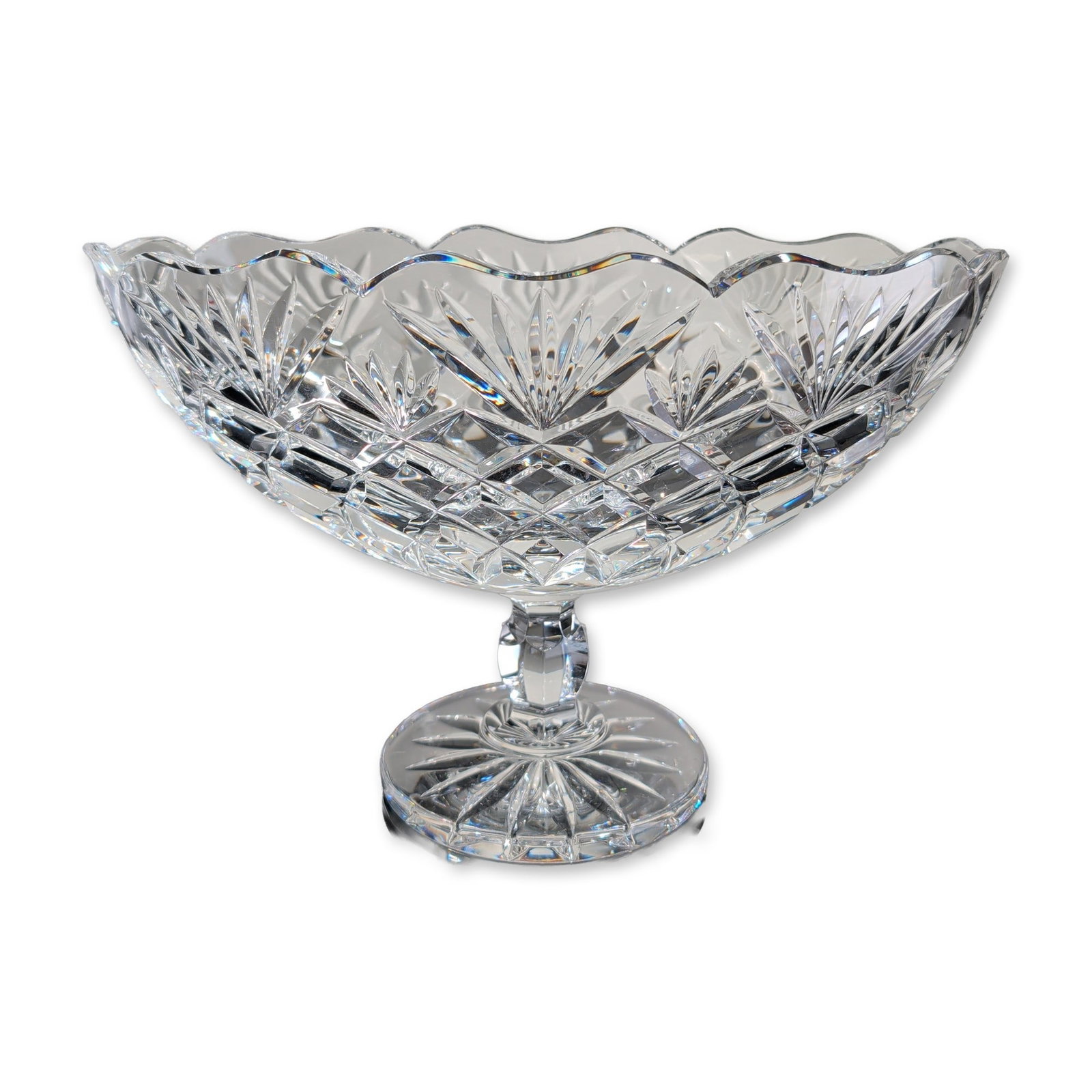 Waterford Crystal Artisan Collection Scalloped Boat Bowl: Featuring a scalloped rim above alternating fan and cross-hatched diamond-cut bands. The vessel is supported by a short pedestal stem with a faceted knop and a circular base decorated with a deeply cu