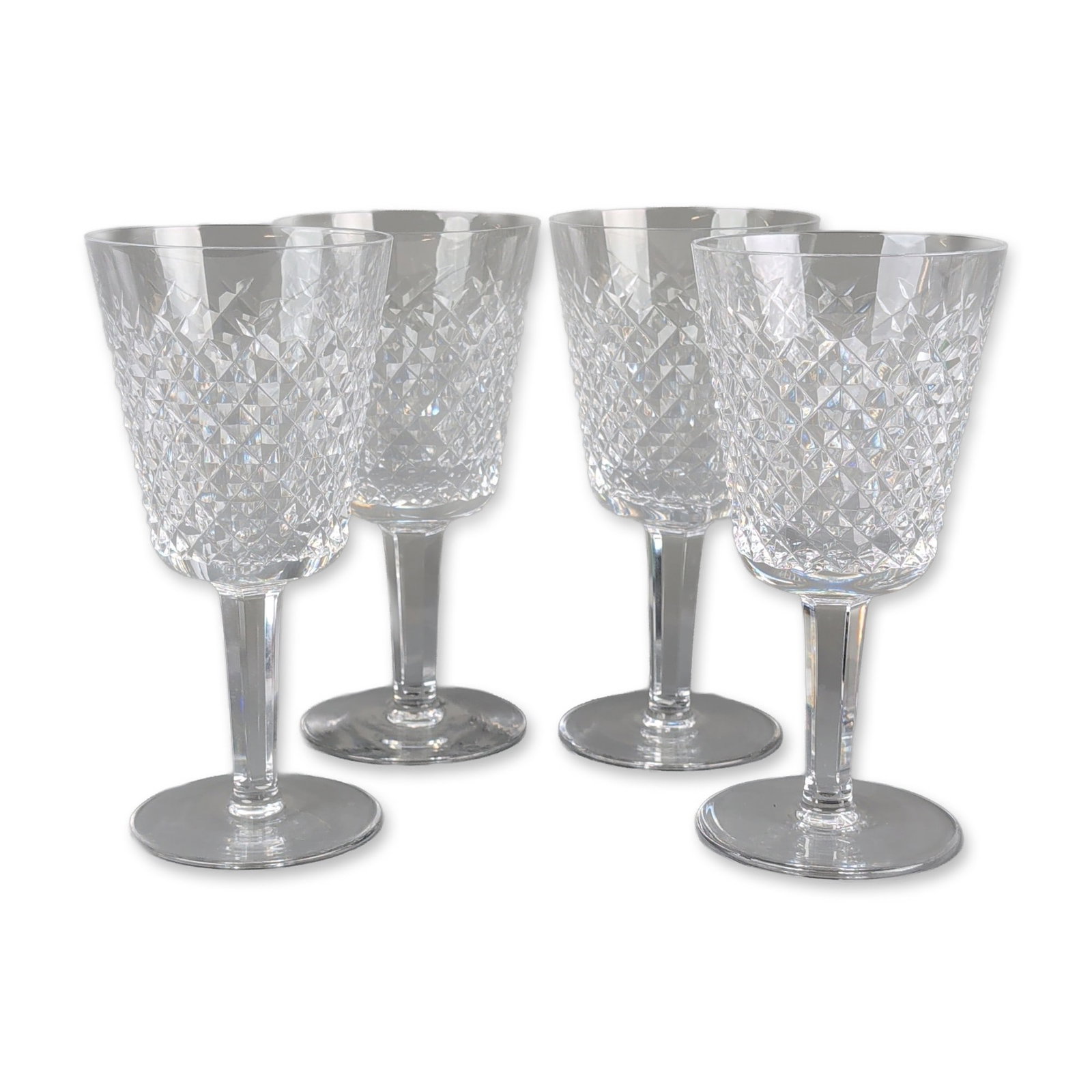 4pc Waterford Alana Crystal Wine Goblets: Waterford Crystal. Set of wine goblets in the Alana pattern, crafted from heavy lead crystal. The bowls feature an all-over diamond-cut design above a multisided, faceted stem and plain circular foot.