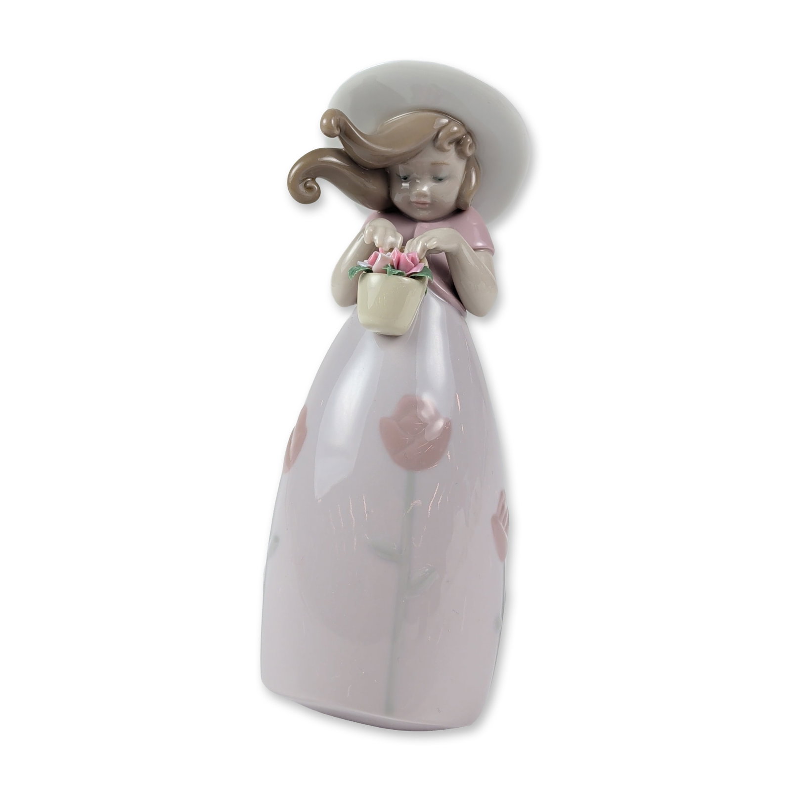 Lladro Porcelain Figurine, Little Rose Girl 1008042: Lladro glazed porcelain figurine, model 1008042, titled Little Rose Girl. The piece portrays a young girl in a wide-brimmed white sun hat and pink bodice, with a bell-shaped lavender-gray skirt featur