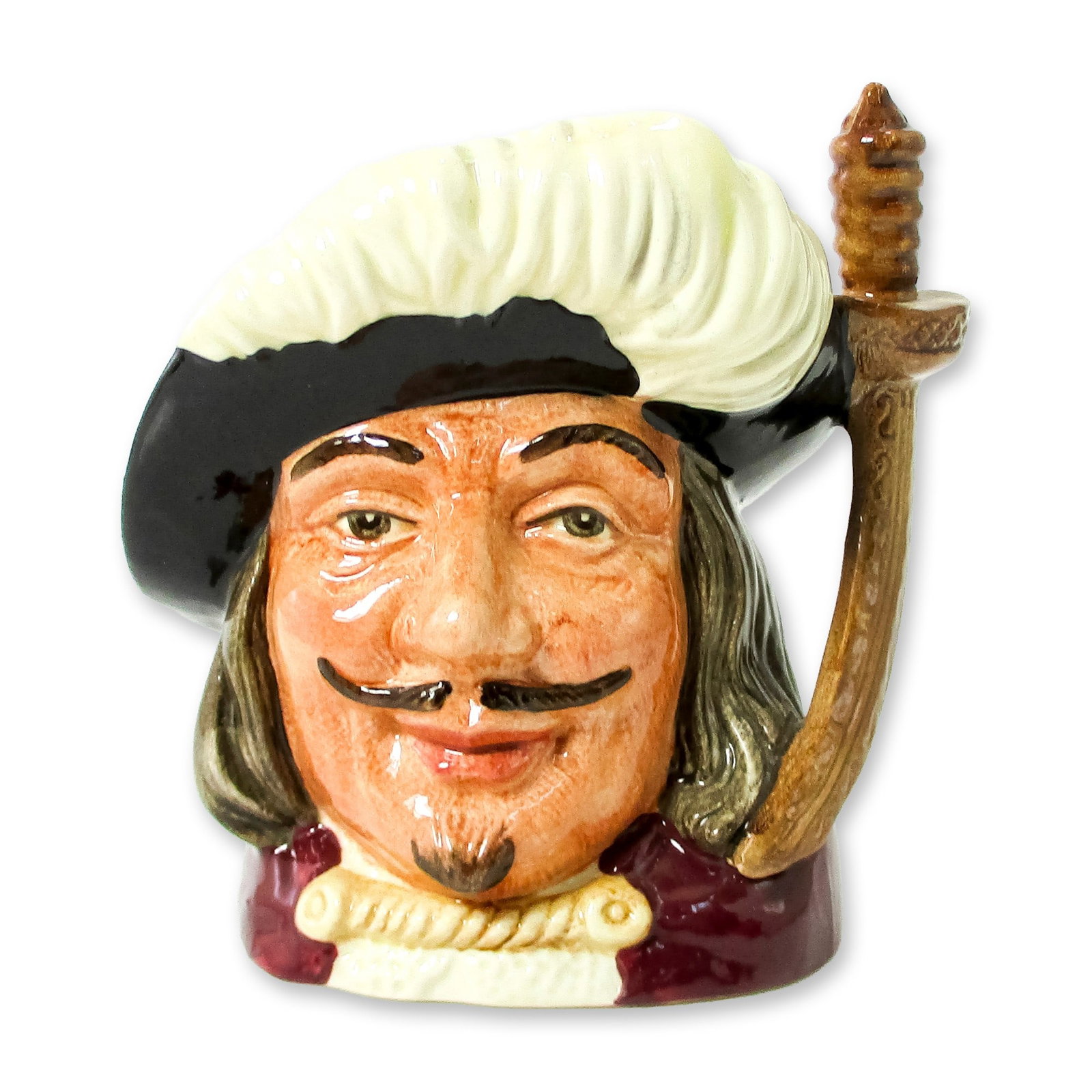 Porthos D6453 - Small - Royal Doulton Character Jug: Variation One. Black hat; red cloak; black hair and moustache. Series: The Three Musketeers; Characters from Literature. Royal Doulton backstamp. Artist: Max Henk Dimensions: 4"H Date or Era: 1956 - 1
