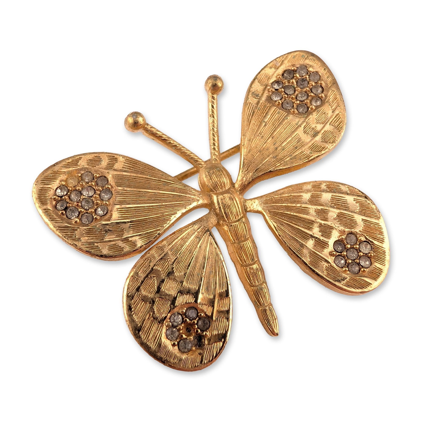 Christian Dior Germany Gold Tone Rhinestone Butterfly Brooch: Christian Dior figural butterfly brooch in gold-plated base metal, manufactured in Germany. The design features four engine-turned textured wings and a segmented body with two antennae. The wings are 