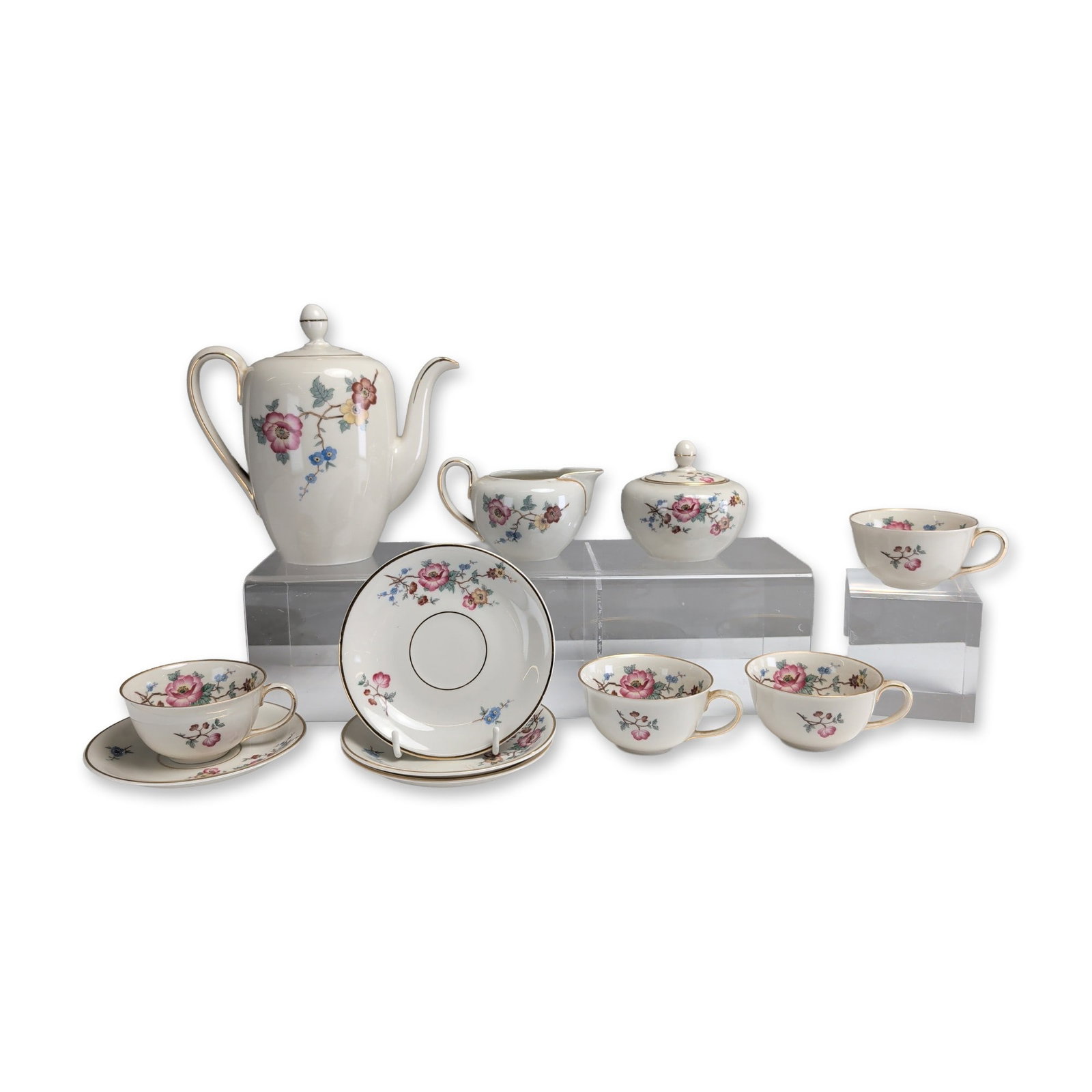 11pc Johann Haviland Bavaria Porcelain Coffee/Tea Service: Johann Haviland, Bavaria, eleven piece coffee or tea service in white glazed porcelain, decorated with multi-colored floral sprays and gilt trim on rims and handles. The collection consists of one tal