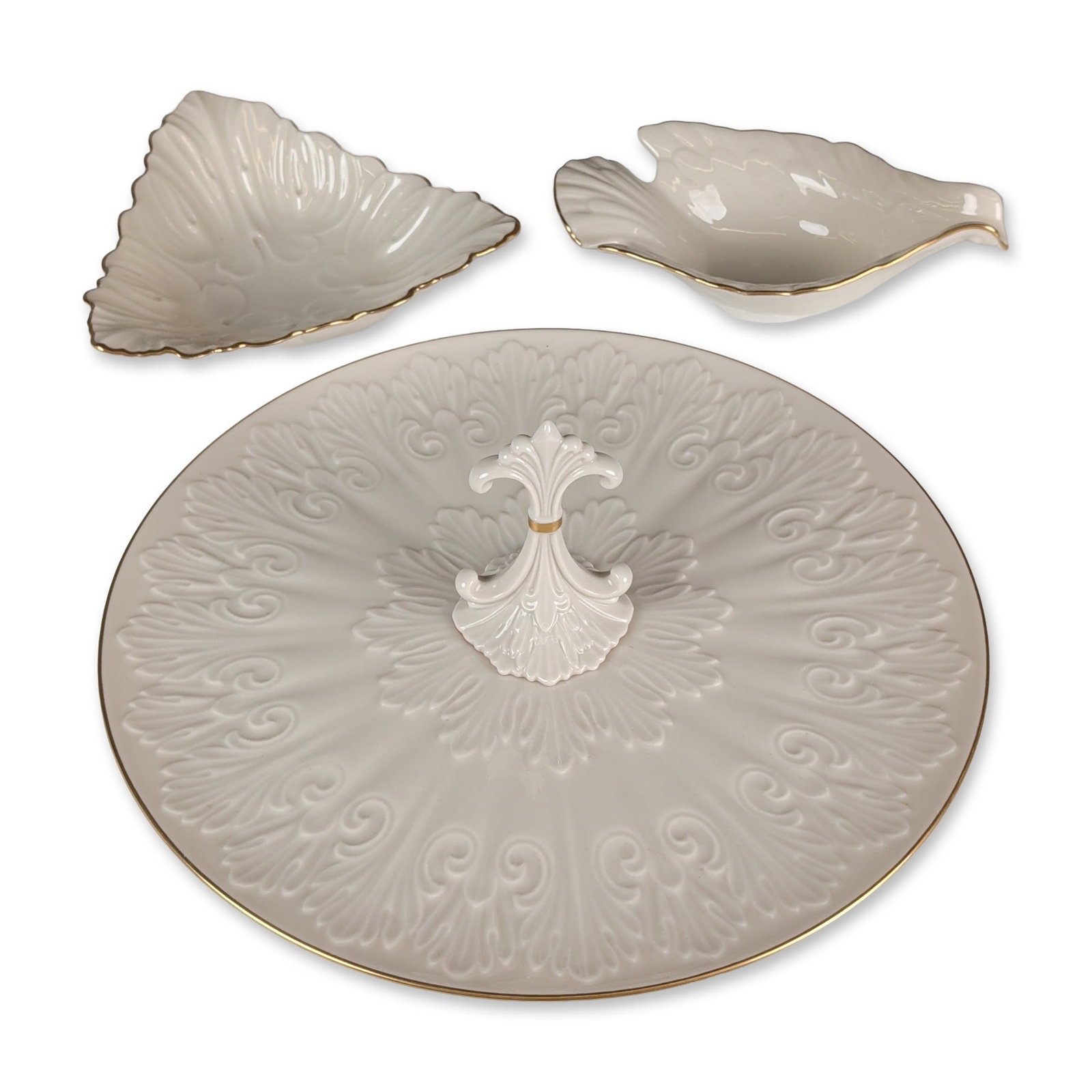 3pc Lenox Chateau Collection Porcelain Bowls and Tray: Lenox American porcelain serving trio from the Chateau collection, in a cream glaze featuring molded relief acanthus leaf and scroll decoration and scalloped gold-gilt rims. The set includes a circula