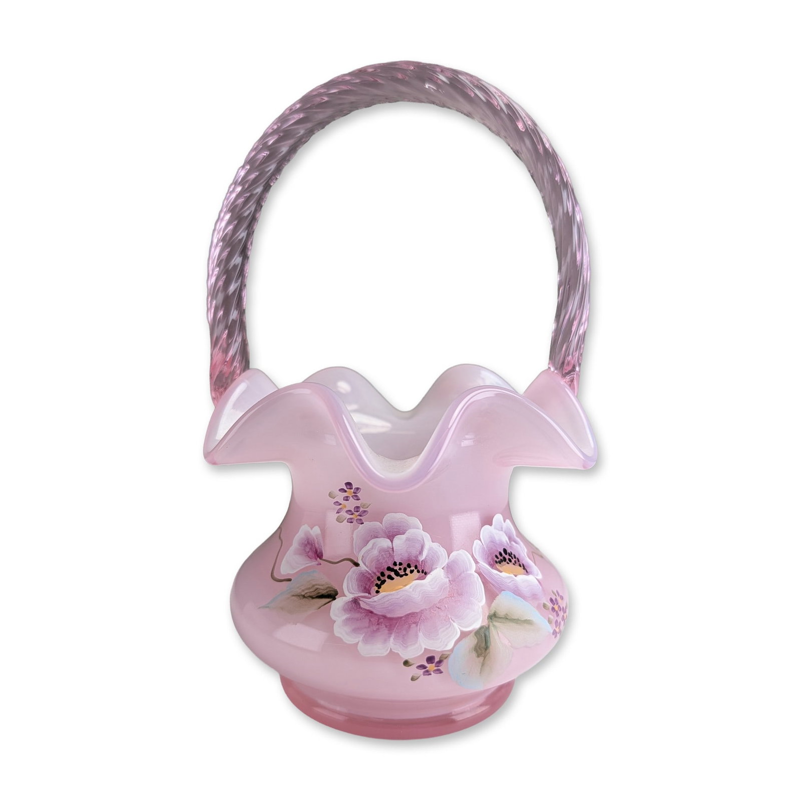 Fenton Rosalene Glass Douglas Caplinger Signed Hand Painted Floral Basket: Fenton Art Glass basket in Rosalene opaque pink cased glass with a white interior. The vessel features a bulbous body, a wide crimped ruffled rim, and an applied twisted handle in translucent pink gla