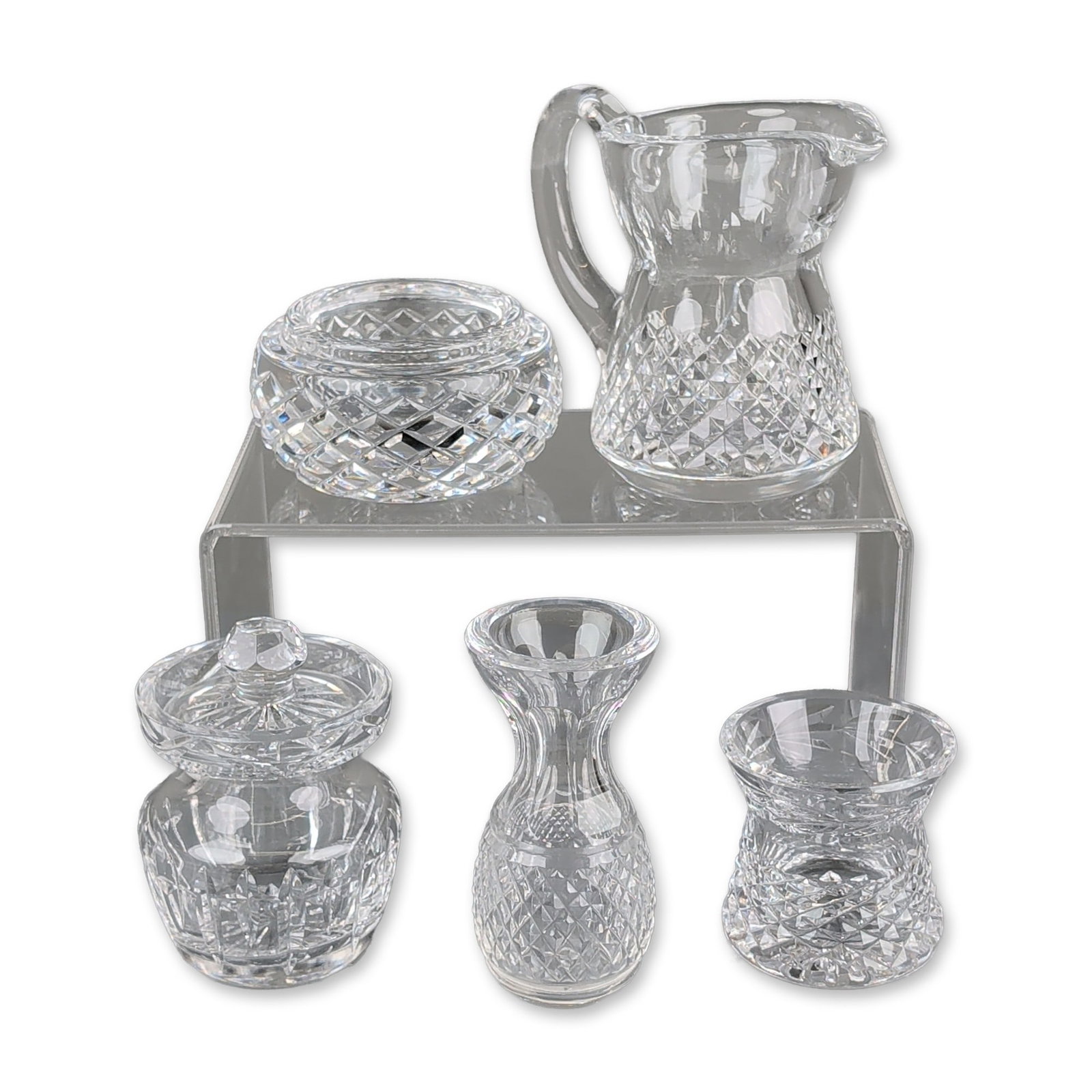 5pc Waterford Cut Crystal Miniature Tableware Collection: Waterford cut crystal miniature table accessories featuring cross-hatched diamond and vertical wedge fan cuts. The group includes a pitcher with an applied handle, a lidded mustard pot with a notched 