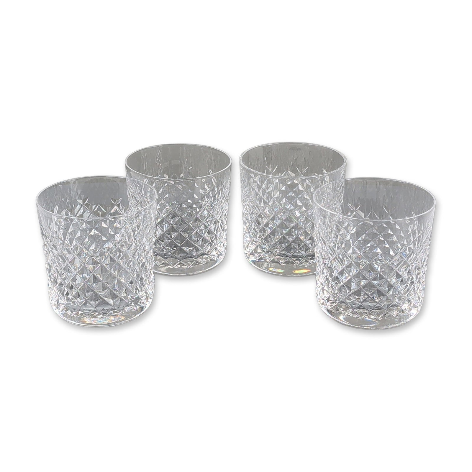 4pc Waterford Crystal Old Fashioned Tumblers, Alana Pattern: Waterford Crystal set of four old-fashioned tumblers featuring a band of deep criss-cross diamond cuts surmounted by vertical wedge cuts and a plain polished rim. Each glass bears an acid-etched mark 