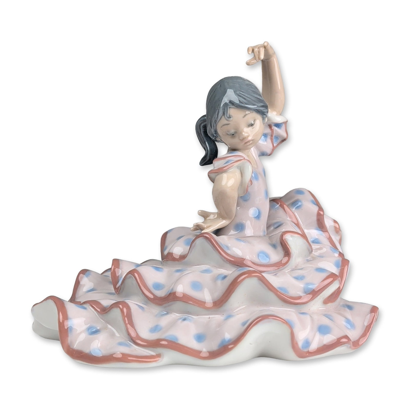 Lladro Porcelain Figurine, Spanish Dancer 01005390: Lladro glazed porcelain figurine of a young flamenco dancer, model number 01005390. The figure is depicted in a dynamic dance pose, wearing a tiered ruffled dress in a pale pinkish-white glaze decorat
